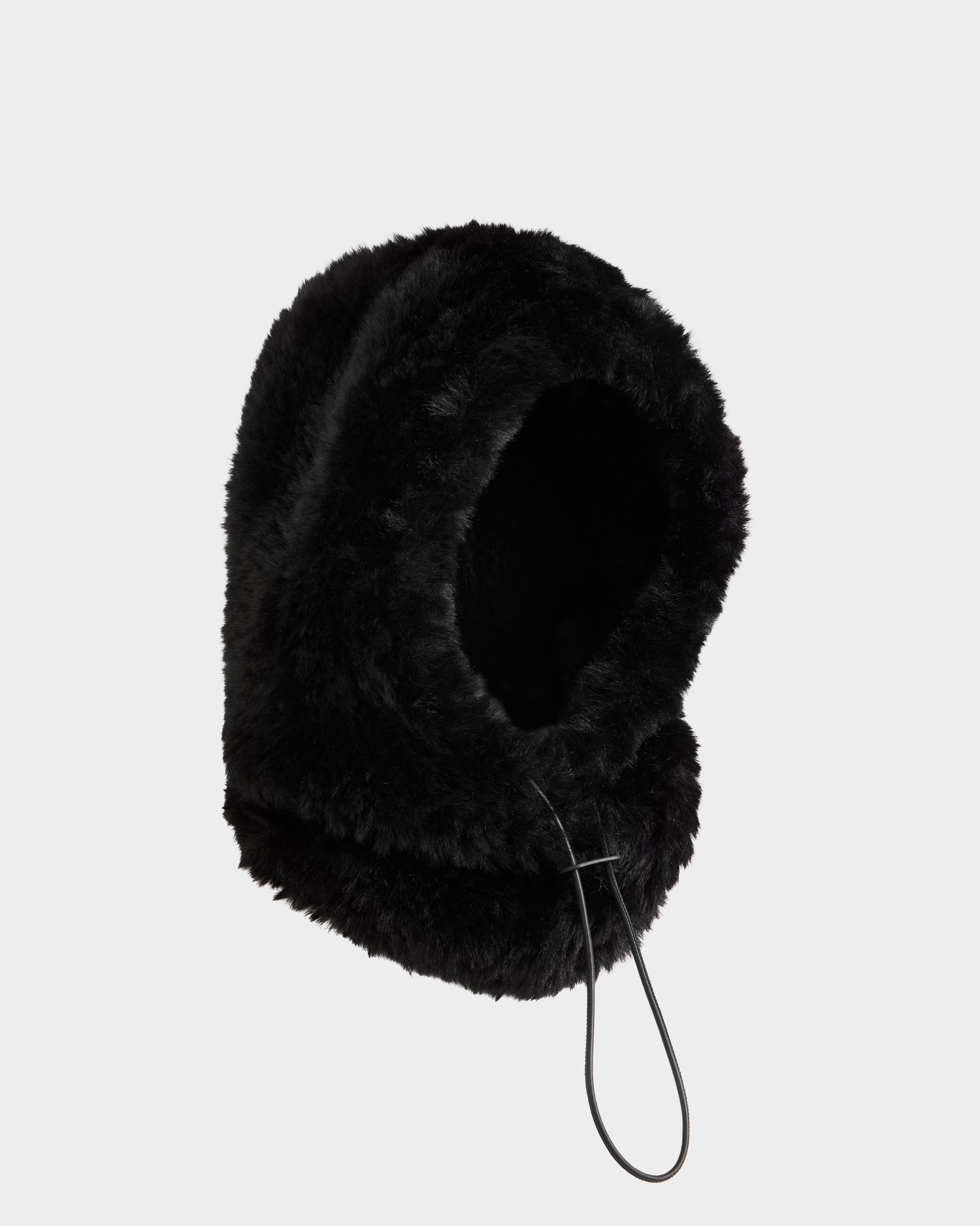 The Rudsak TARA - 8425025 Black women’s faux fur balaclava hood features a drawstring and is ideal for cold weather, shown on a plain light gray background.