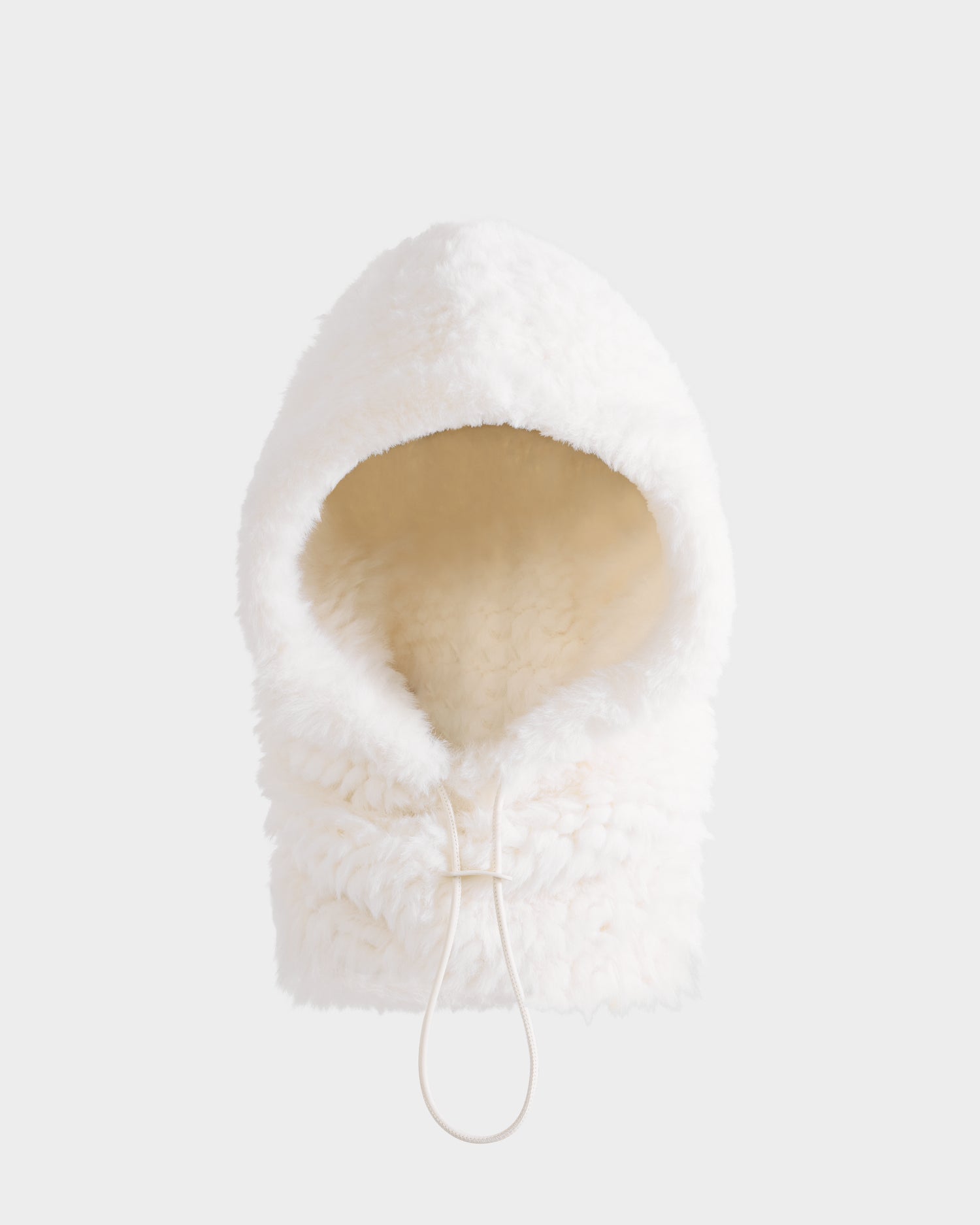 The TARA - 8425025 Iceland balaclava by Rudsak features white, fluffy faux fur, a plush texture, and an adjustable chin drawstring—a cozy women’s winter accessory ideal for après-ski style.