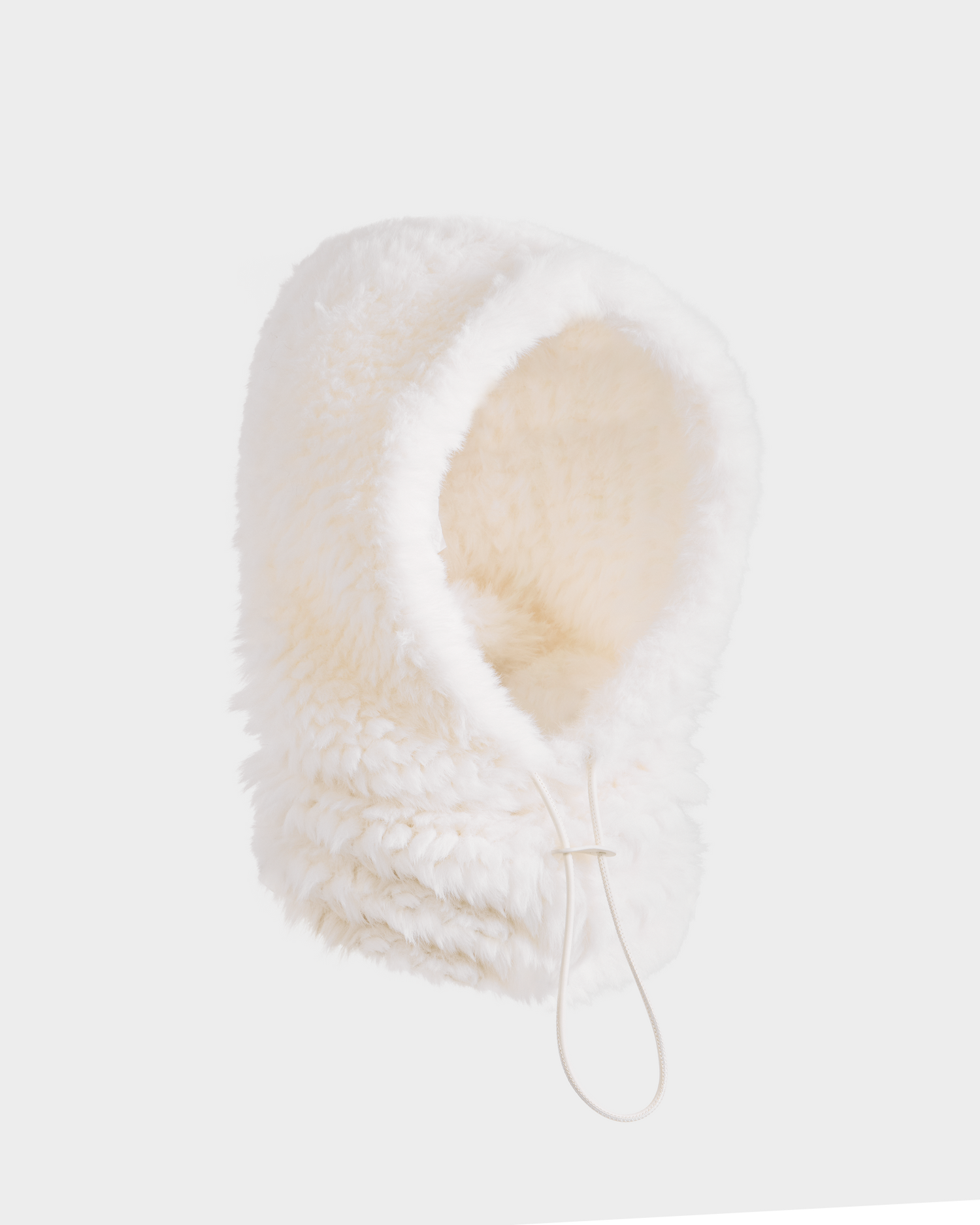 The Rudsak TARA - 8425025 Iceland is a fluffy white faux fur balaclava hood with an adjustable drawstring, shown against a plain white background—perfect for keeping warm and stylish in women’s winter après-ski fashion.