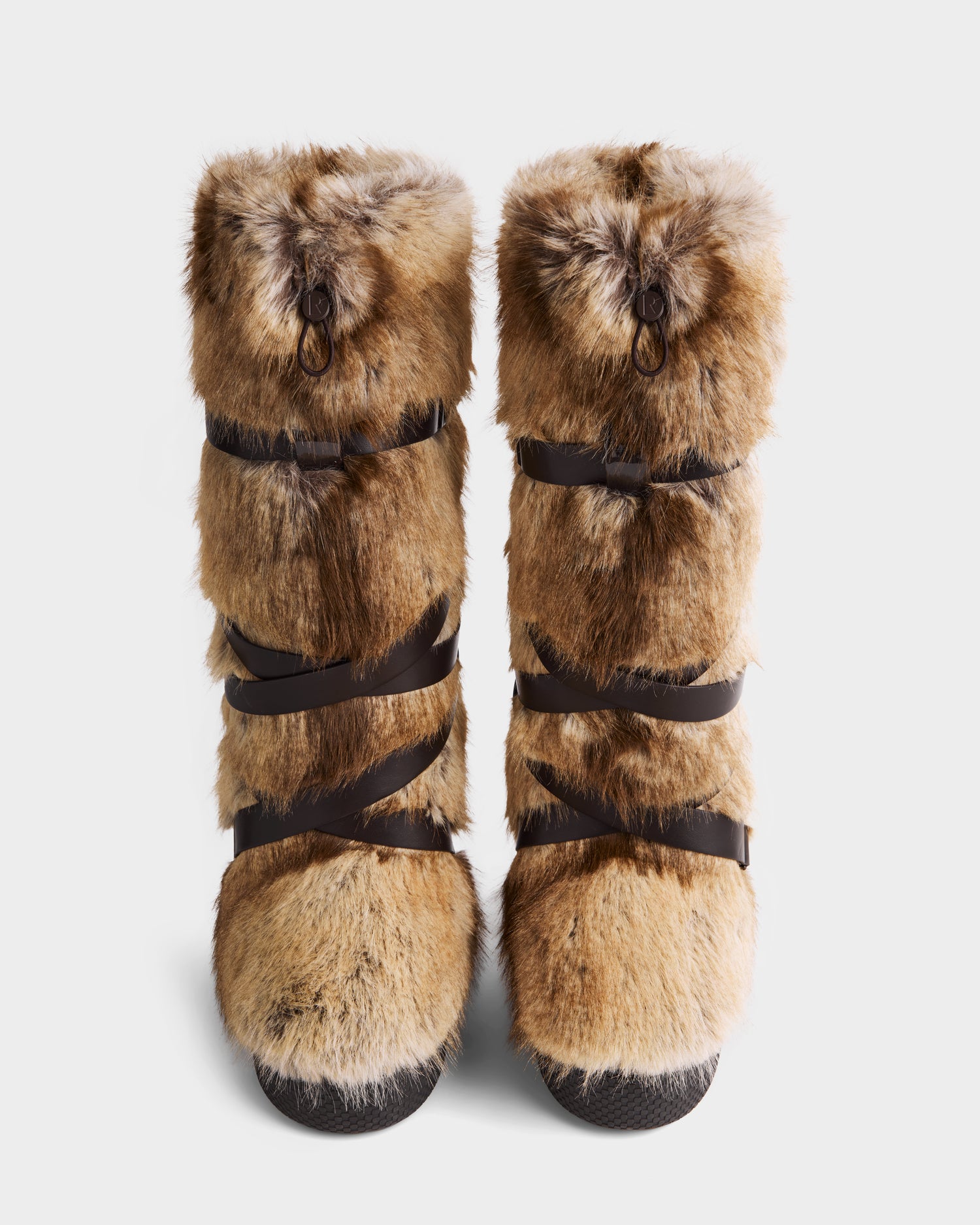 A pair of Rudsak TORIN - 8225029 Mix Mocha tall women’s faux fur moon boots with black leather straps, shown from the front against a white background.