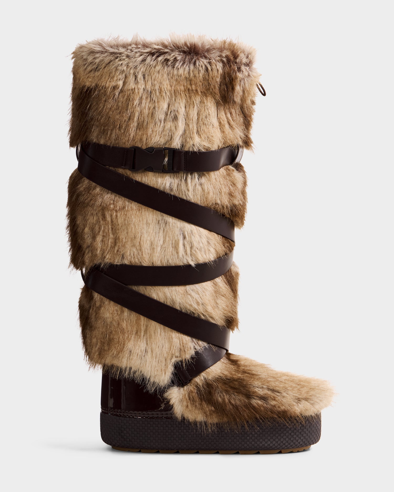 The TORIN - 8225029 Mix Mocha by Rudsak is a tall women’s moon boot featuring light brown faux fur, dark brown leather straps around the shaft, and a thick textured sole—perfect for winter style or après-ski.
