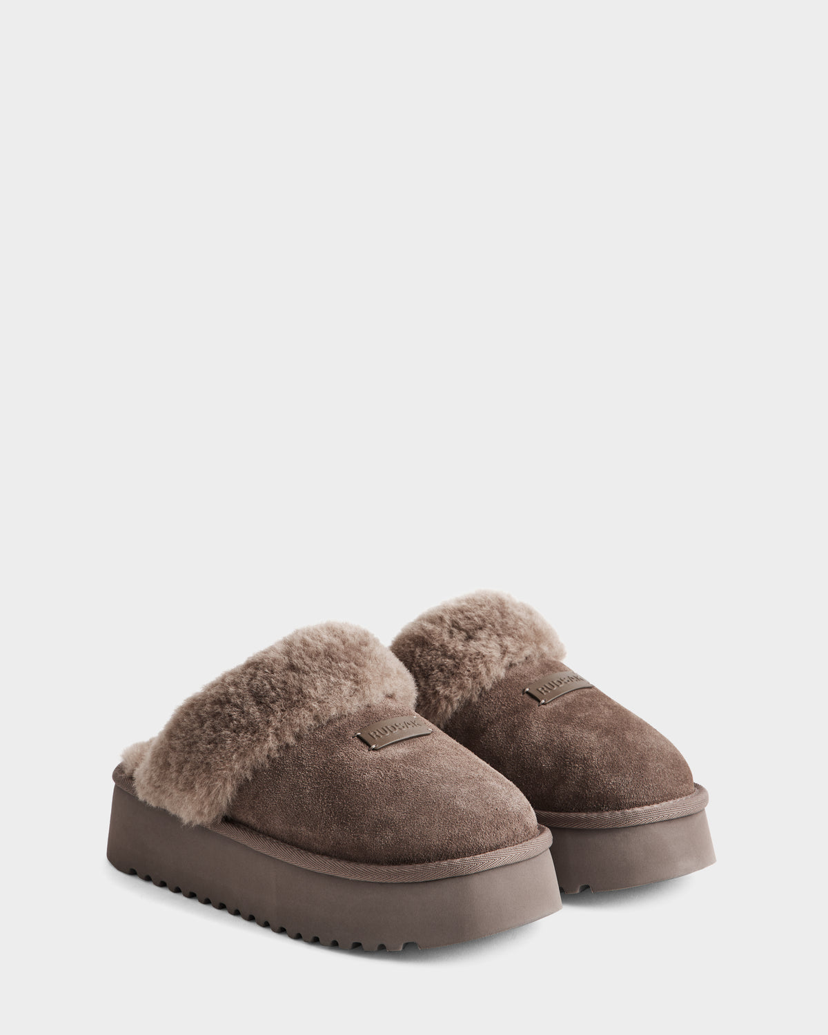 The Rudsak WILMA - 8225582 Mocha slippers for women feature brown suede, a plush fuzzy lining, platform sole, and easy slip-on design. Shown on a plain white background.