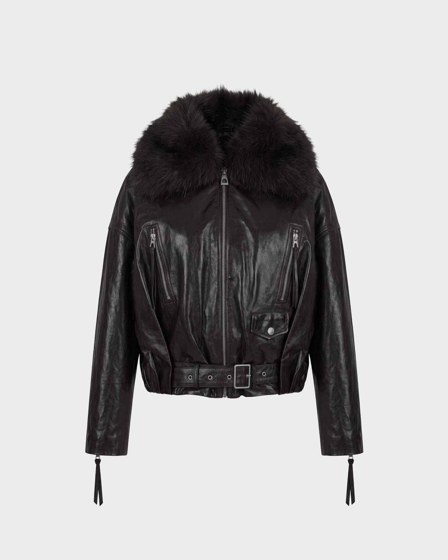 The Rudsak AVITA - 8126938 Black leather jacket features a wide, fluffy faux fur collar, a belted waist, zipper and button details, and zippered sleeves, shown against a plain white background.