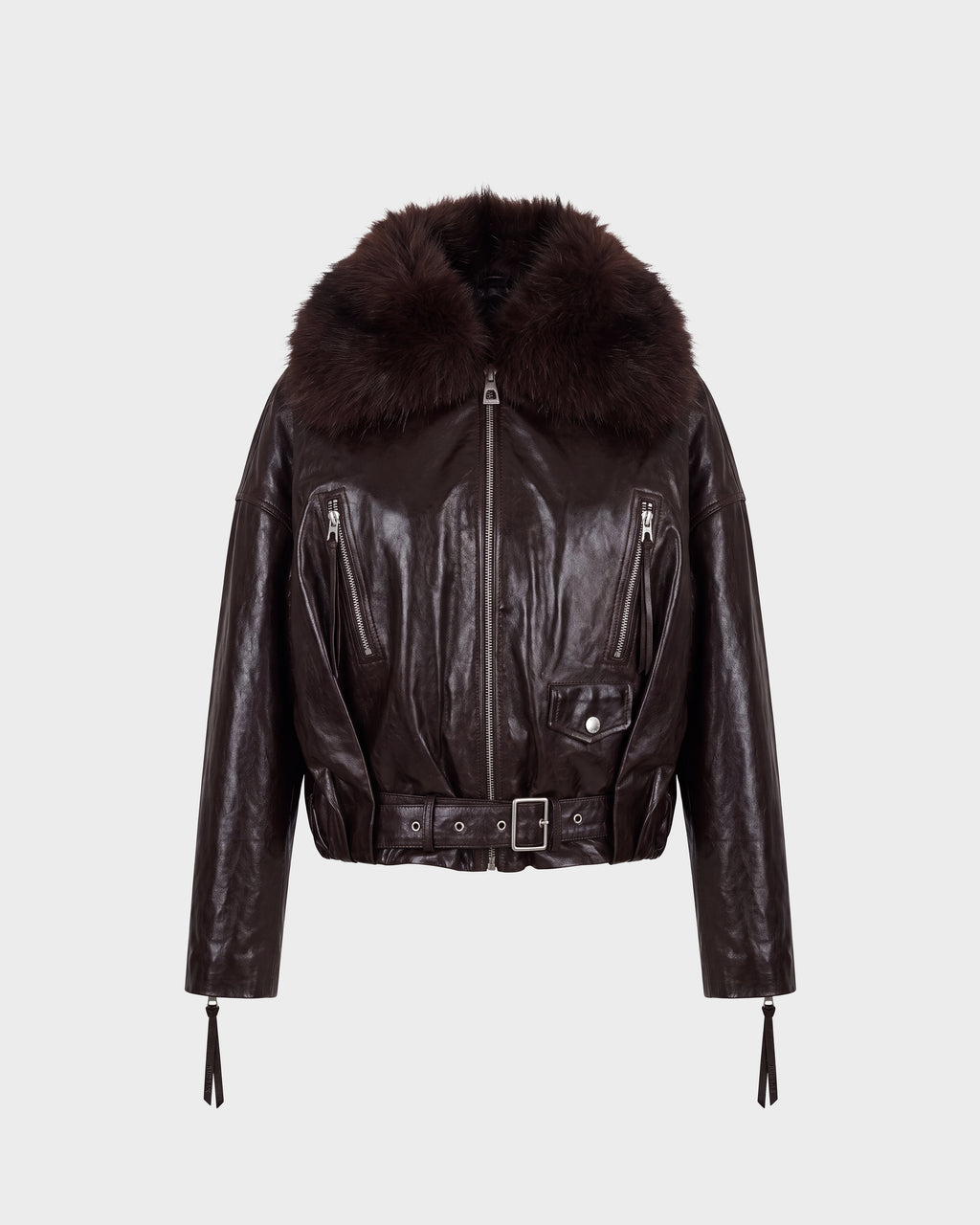 The AVITA - 8126938 Espresso by Rudsak is a dark brown leather jacket featuring a wide, fluffy fur collar, zippered pockets, a belted front with a buckle closure, and long sleeves with zippered cuffs. The jacket is showcased against a plain light background.