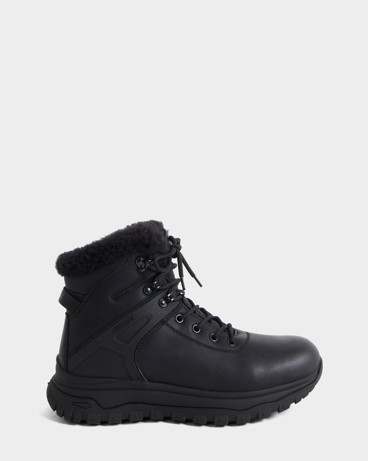 The BRYSON - 6226504 Black by Rudsak is a black leather lace-up winter boot with a rugged lugged outsole and faux fur ankle lining, shown side view on a white background.