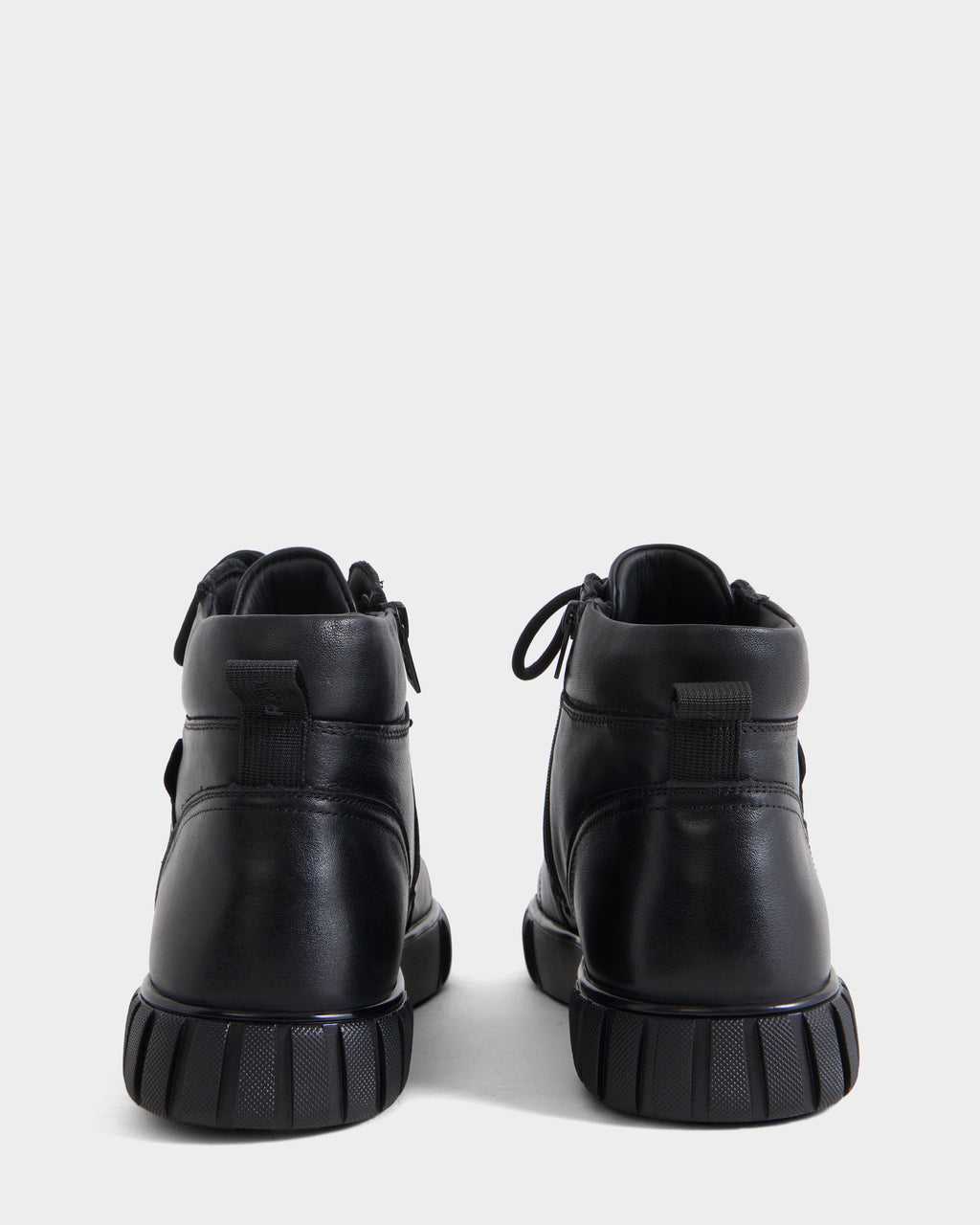 Back view of DAVE - 6226501 Black leather high-top boots with thick, ridged rubber soles.