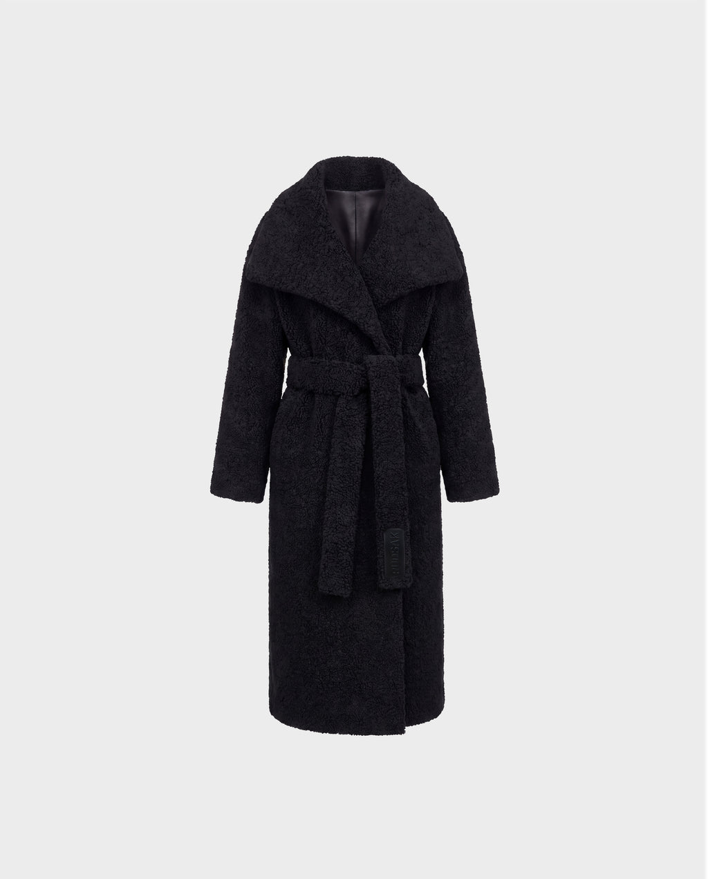 The FRANCIE - 8126873 Black coat by Rudsak is a long black belted design featuring a wide collar and textured plush faux shearling fabric, shown against a plain light gray background.