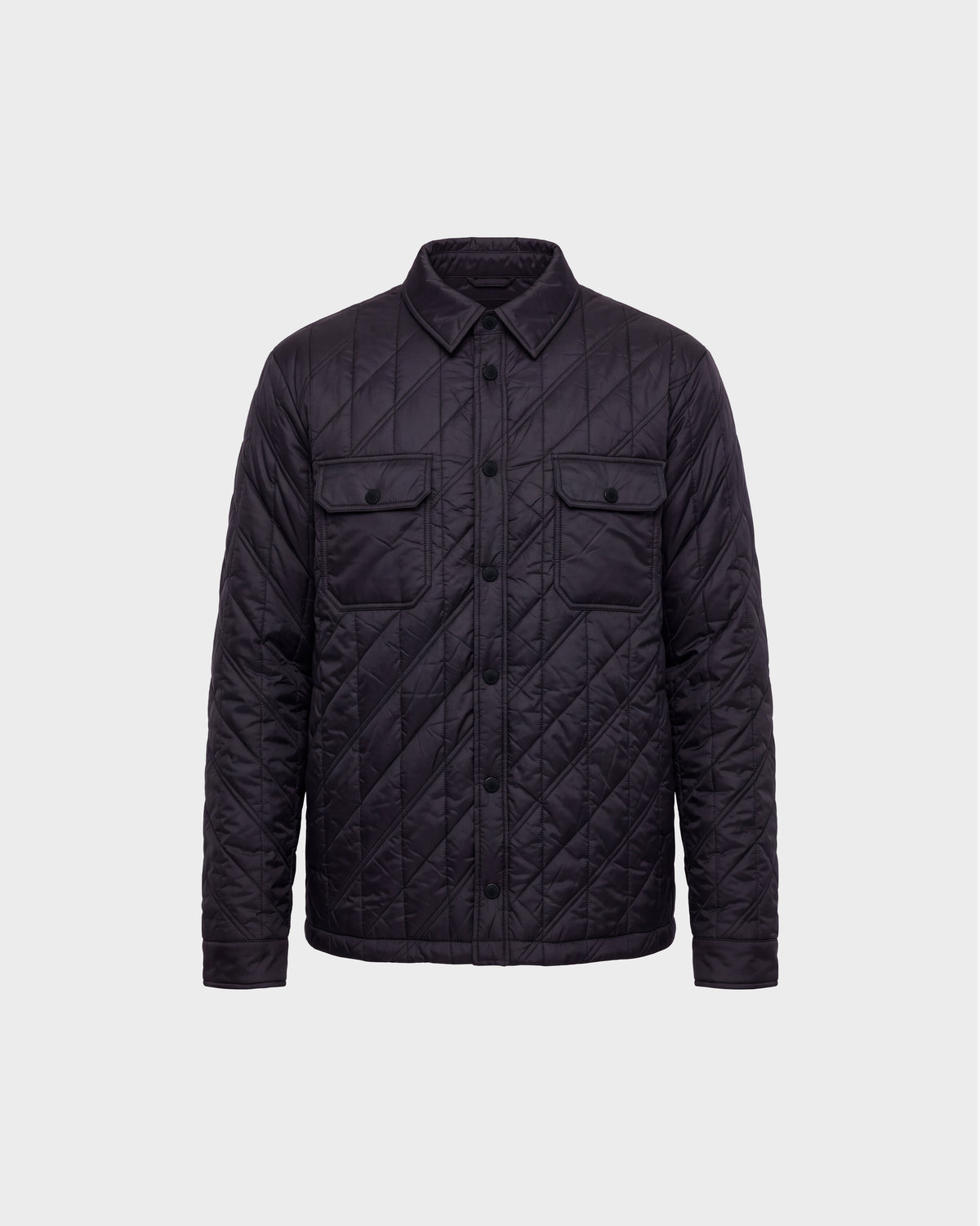 GRIFFIN - 6126758 Black quilted jacket by Rudsak, featuring a button-up front, two chest flap pockets, and a collar, displayed on a plain light gray background.