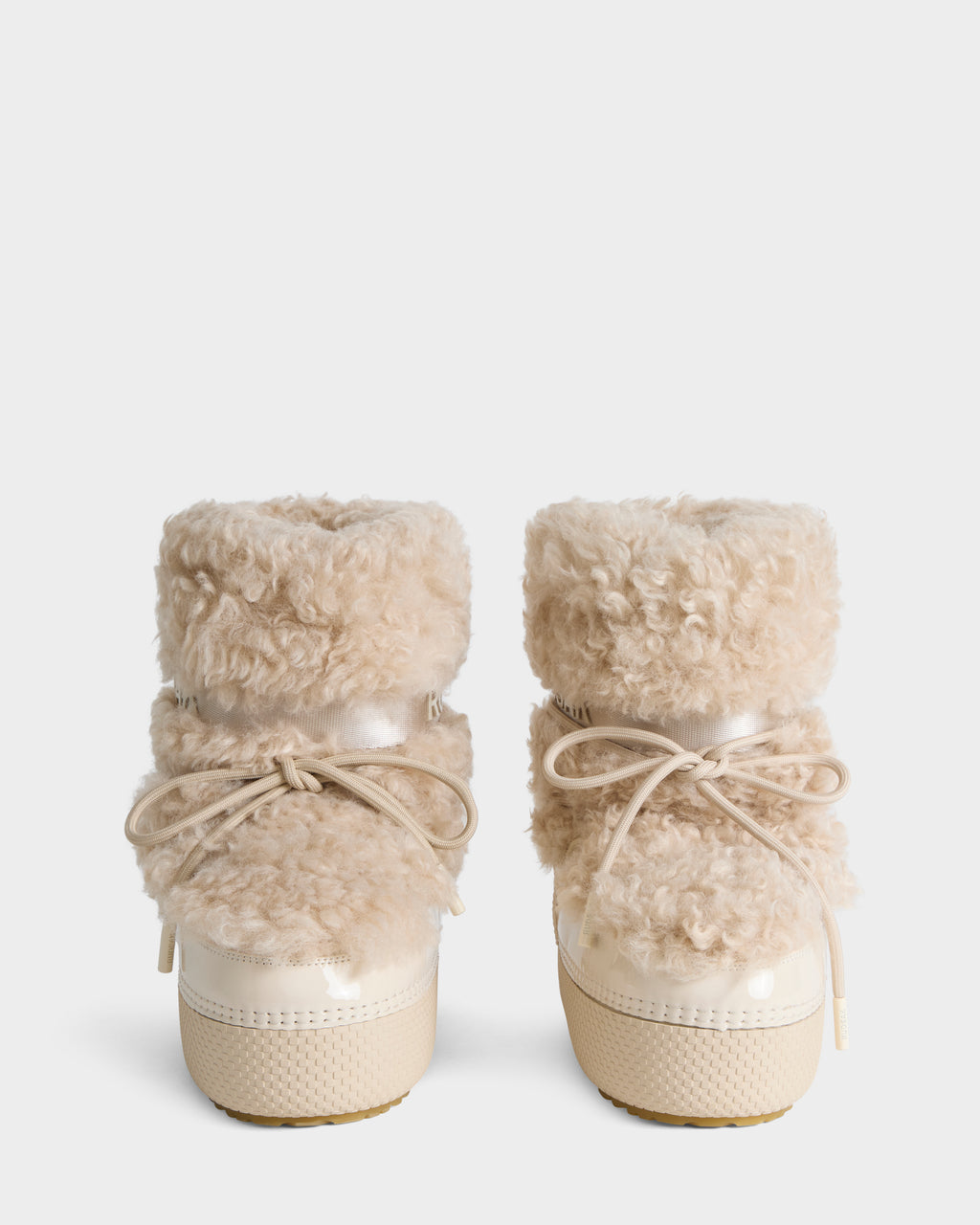 KATHY Y - 1224500 Vanilla cream-colored ankle boots featuring fluffy shearling cuffs, lace-up fronts, and thick platform soles.