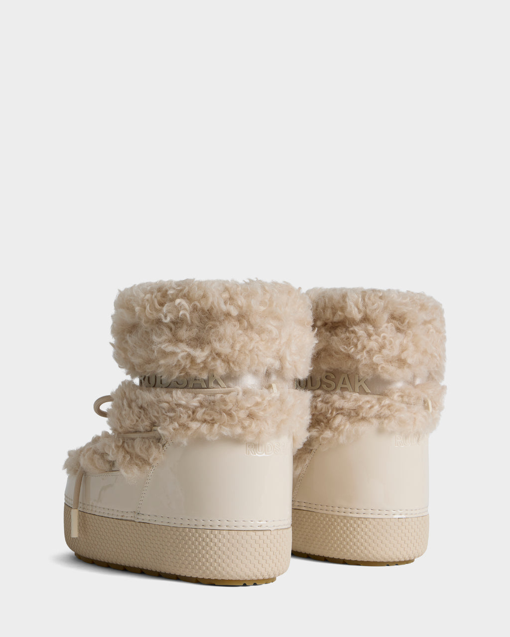 Cream-colored Rudsak KATHY Y - 1224500 Vanilla winter boots with a platform sole and fuzzy trim at the ankle.