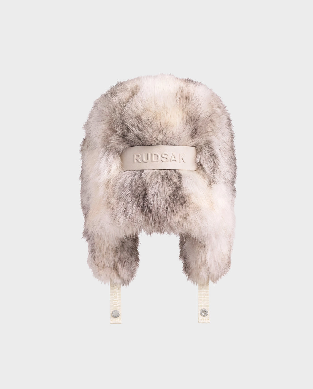 Rudsak LIRA - 8425024 Mix Vanilla cream and grey faux fur aviator hat featuring a logo-embossed strap across the back and chin straps with snap buttons for winter warmth.