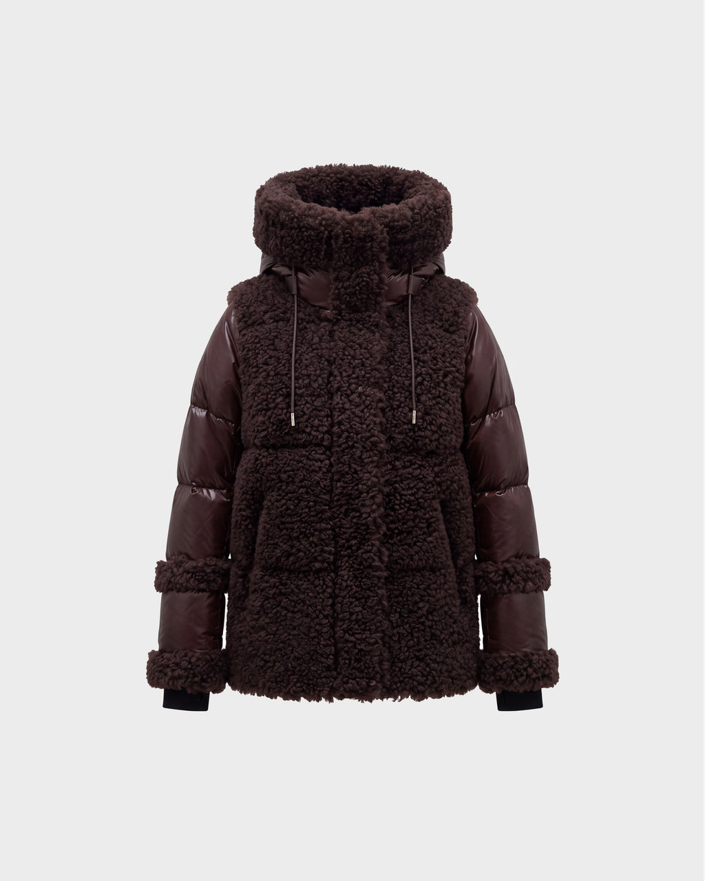 A women’s winter jacket, the MARISSA - 8126728 Espresso by Rudsak, in dark brown features a plush sherpa-textured body paired with smooth, quilted down sleeves. The design includes a high collar, drawstrings, and large front pockets. It is photographed against a plain light gray background.