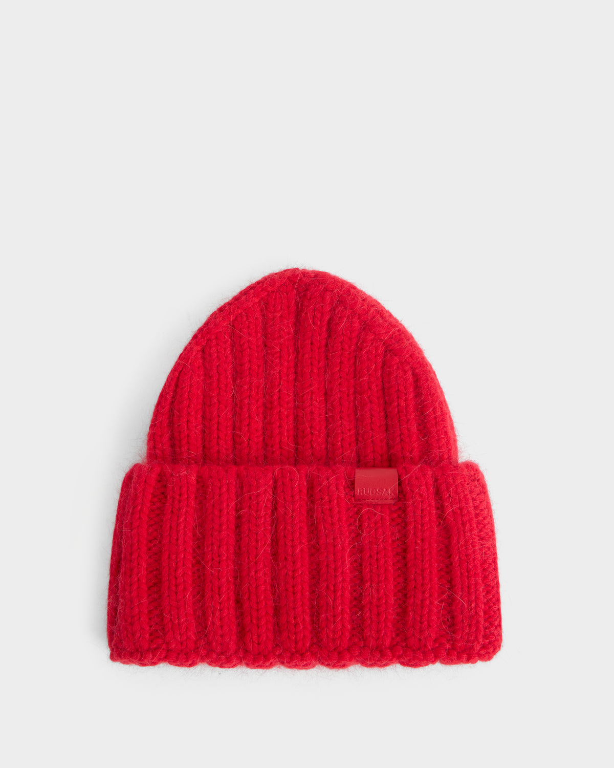 Flame red Rudsak MISSA - 8426512 ribbed knit beanie with a folded cuff and a small logo patch on the front.