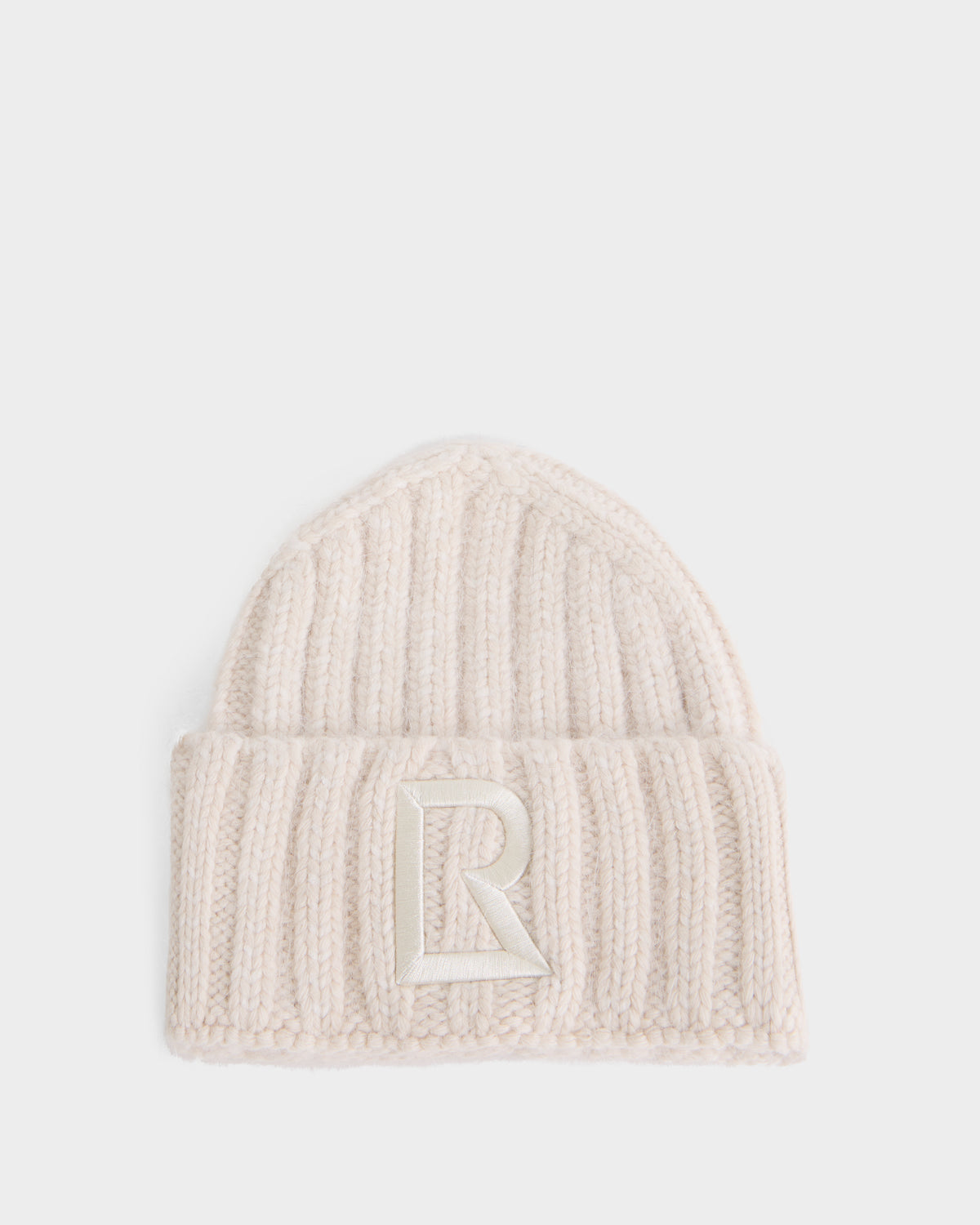 Off-white ribbed knit MISSA - 8426512 Vanilla beanie with a folded brim and a large embroidered letter R on the front.
