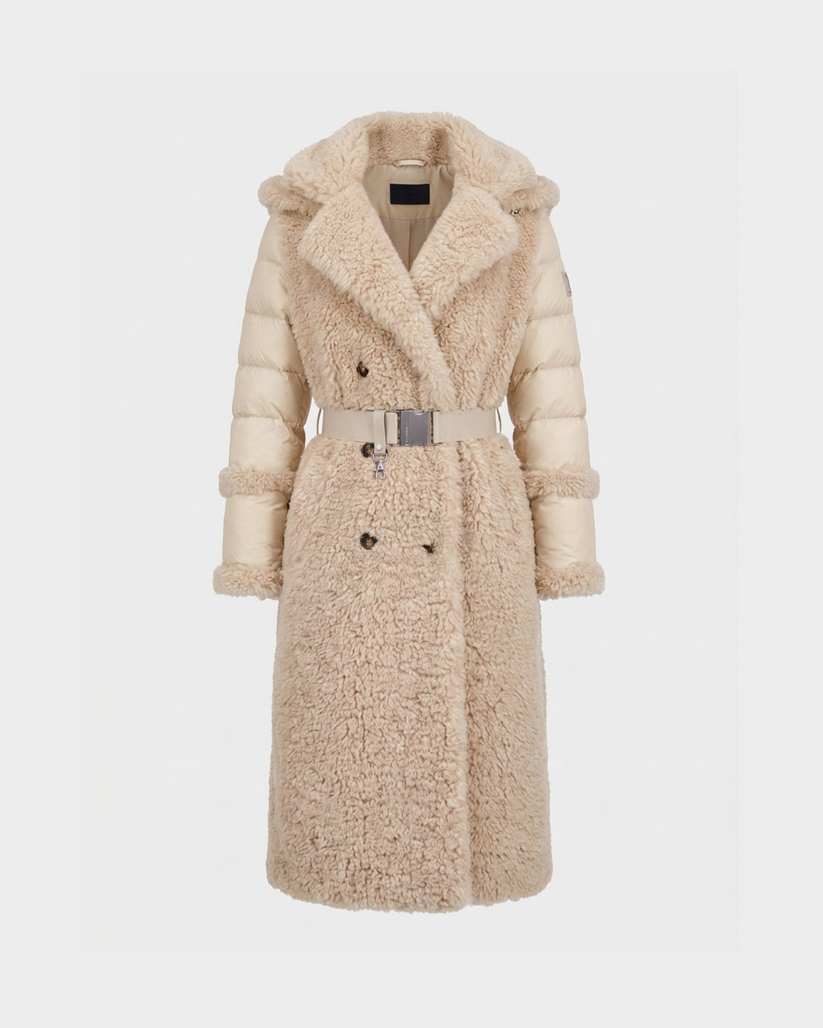 The NOELLE - 8126971 Cream by Rudsak is a long, beige winter coat featuring a plush faux fur front and collar, quilted sleeves resembling a classic down coat, a belted waist, and double-breasted button design, shown against a plain white background.