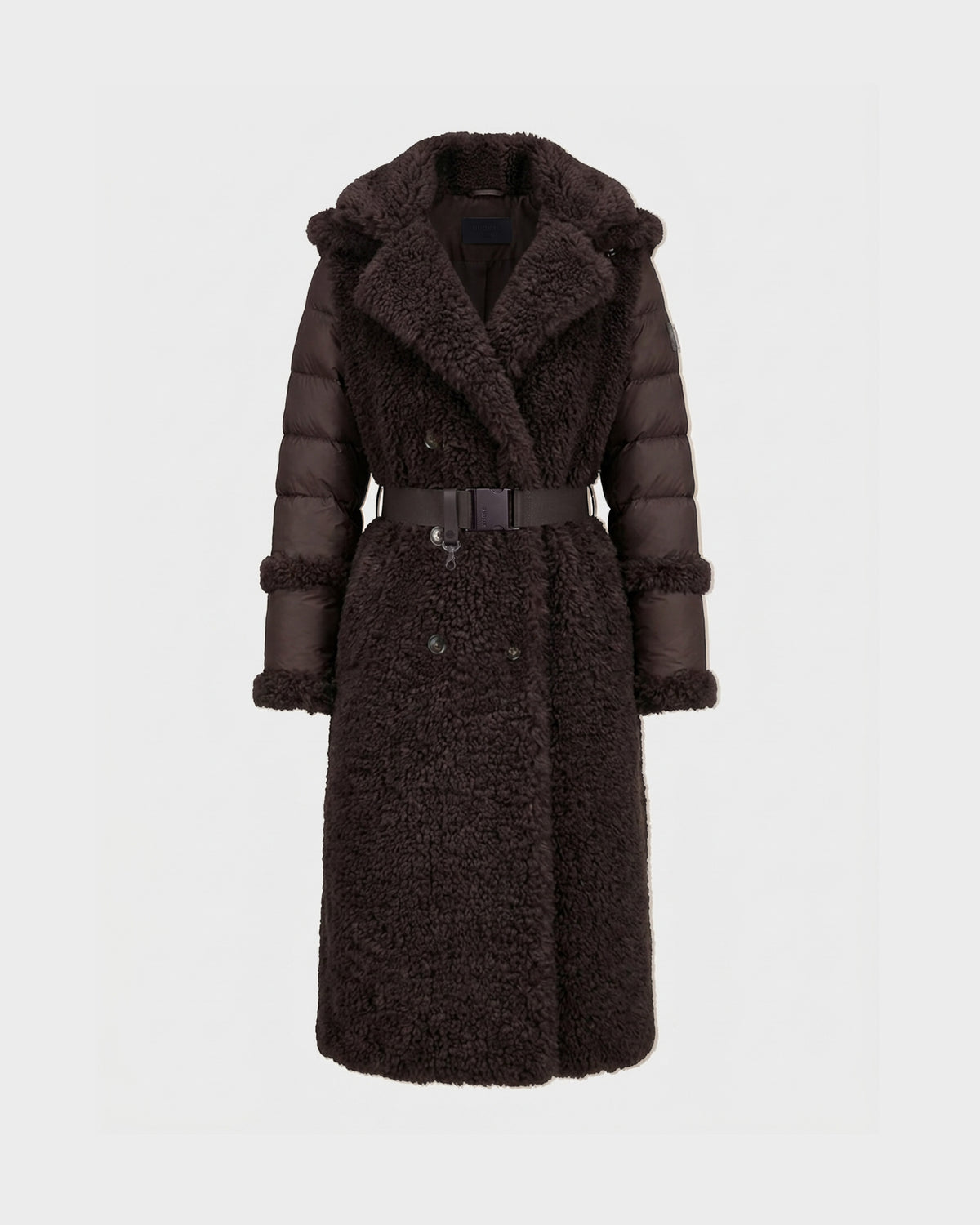 The NOELLE - 8126971 Espresso by Rudsak is a long, dark brown belted shearling coat with quilted sleeves and a large collar, featuring luxurious faux fur accents, displayed against a plain, light background.