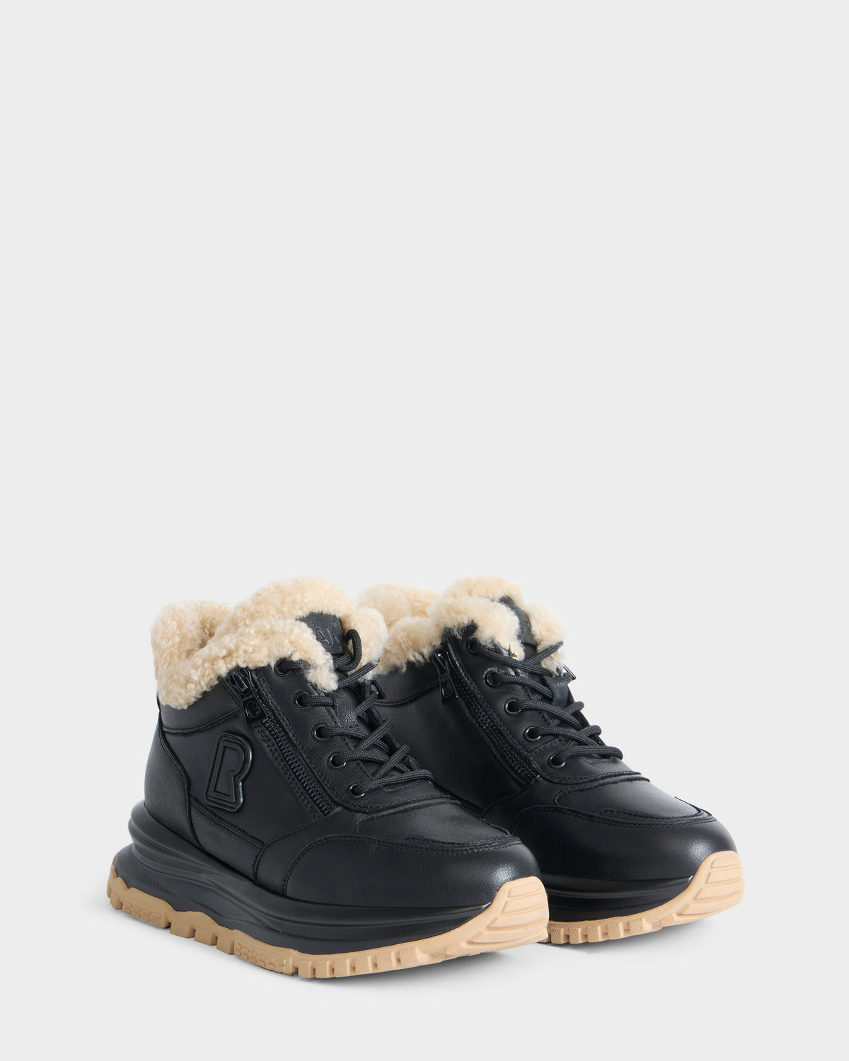 Rudsak VIONA - L226508 Black lace-up ankle boots with faux shearling lining, side zippers, and thick beige lug soles.