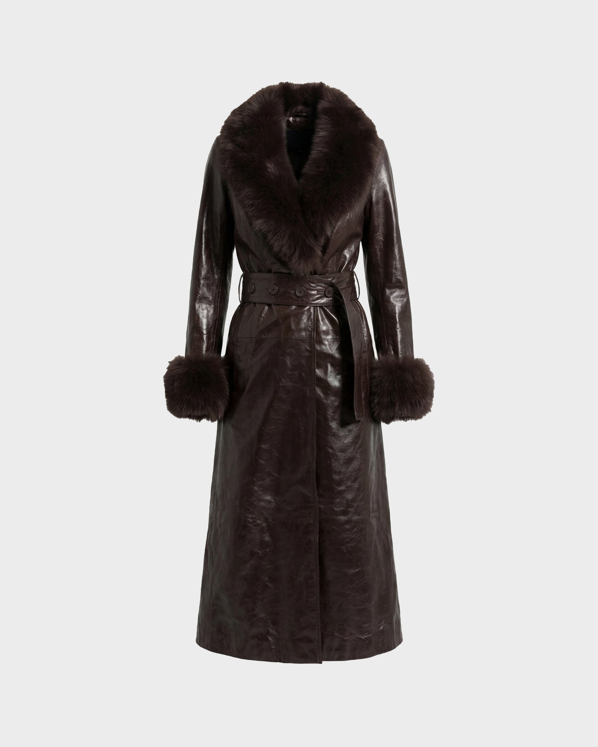 The Rudsak VIVIANNE - 8126933 Espresso is a long, dark brown leather trench coat featuring a wide faux fur collar, fur cuffs, and a matching belt at the waist, shown against a plain light background.
