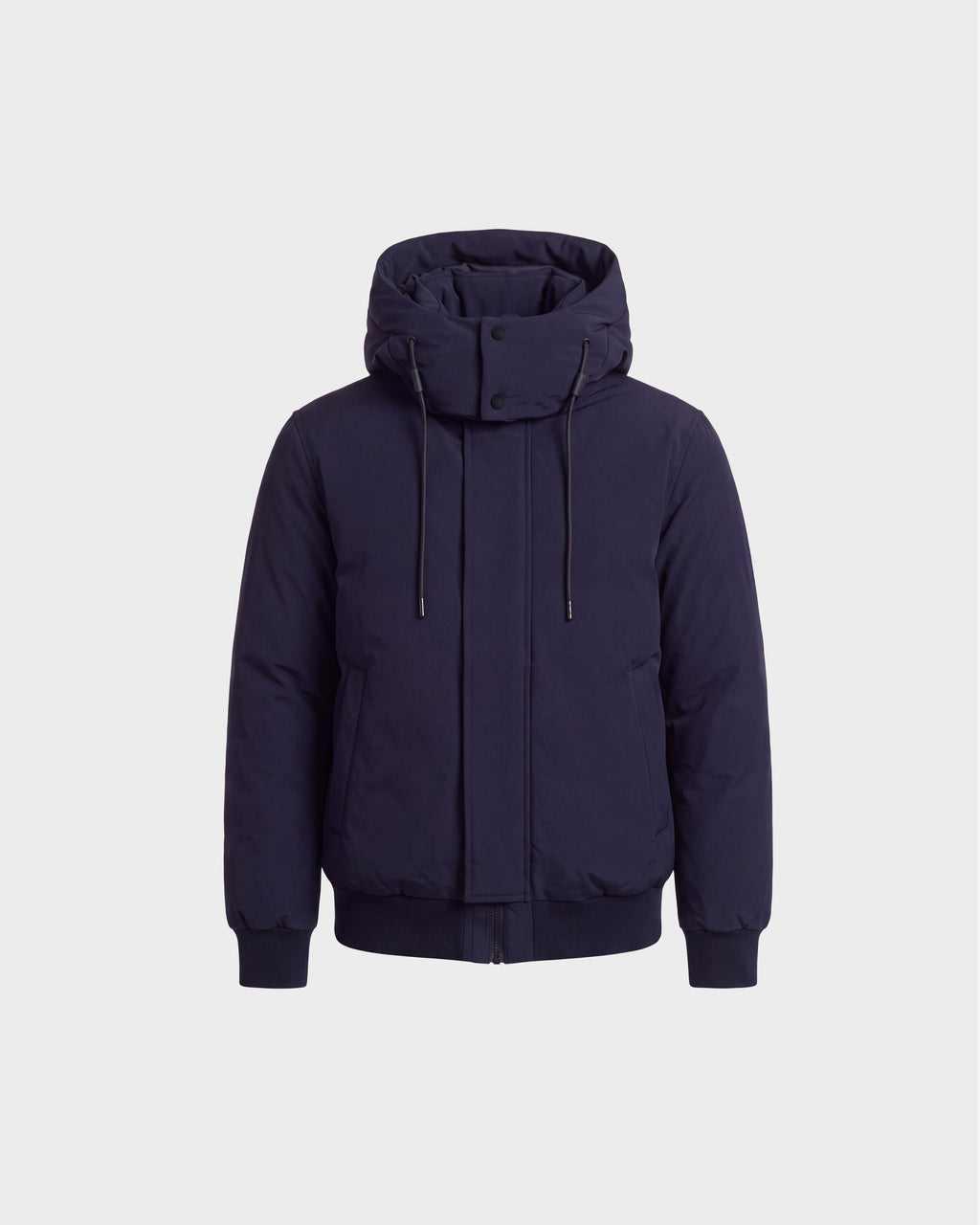 The Rudsak WILL - 6126561 Navy is a navy blue hooded winter coat inspired by the classic bomber jacket style, featuring RDS-certified down filling, a front zipper, snap buttons, drawstrings, and two side pockets. The coat is displayed on a plain white background.