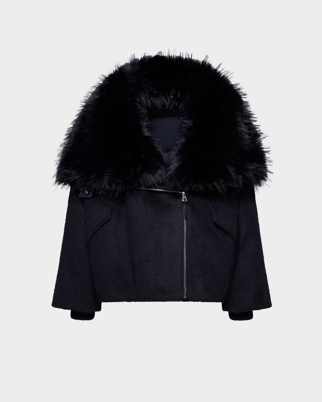The Rudsak ZARIA - 8126999 Black features an oversized winter puffer design with long sleeves, an asymmetrical front zipper, and a removable faux-fur collar, shown on a plain white background.