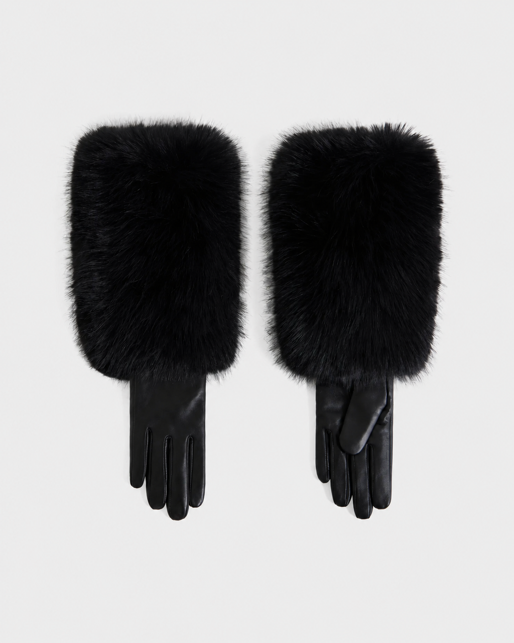 A pair of ZAYLA - 8426712 Black gloves by Rudsak, featuring smooth leather and long, fluffy fur cuffs that extend past the wrists, laid flat on a white background.