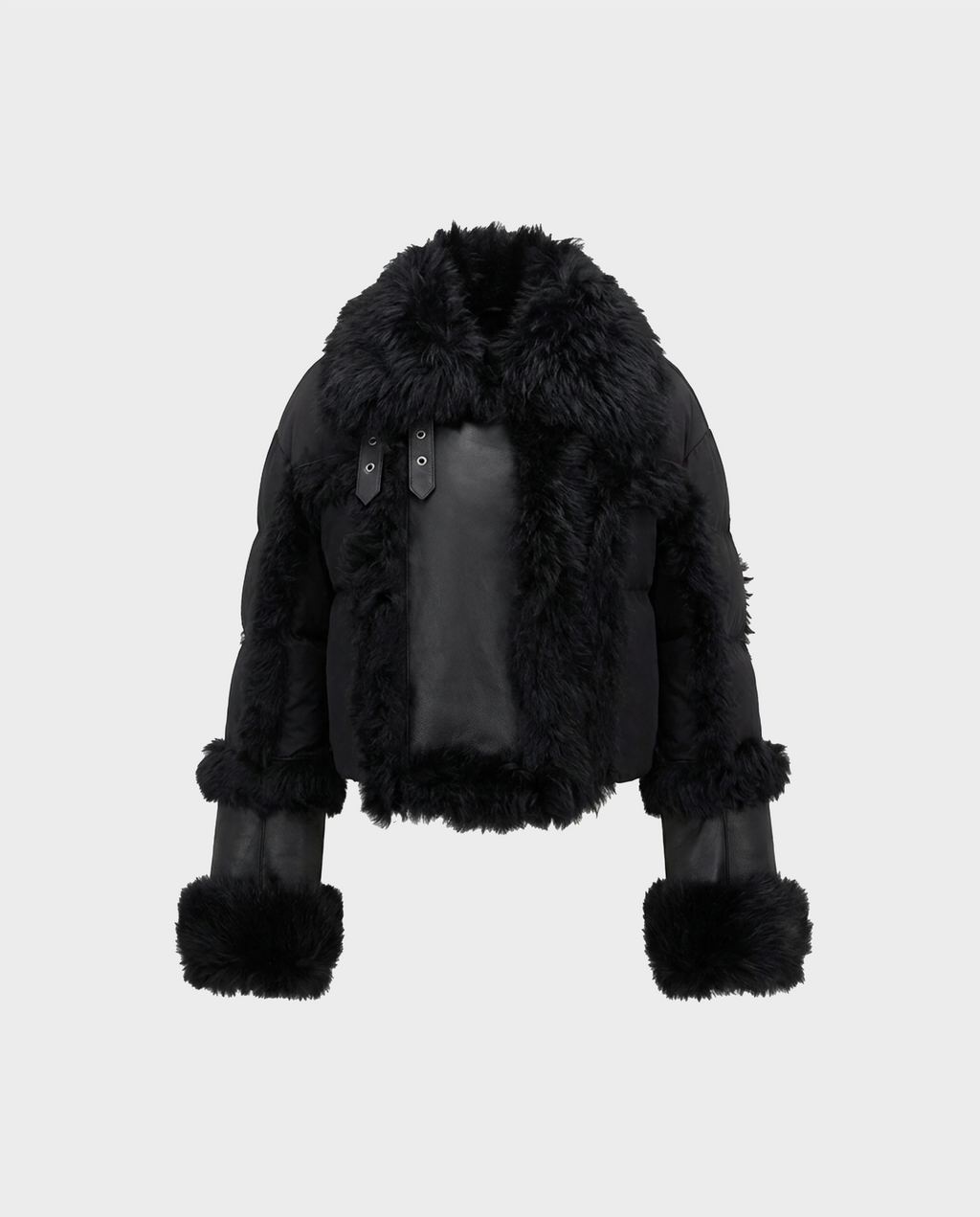 The ZELAIA - 8125577 Black by Rudsak is a black faux fur jacket featuring a cropped cut, large fluffy collar, and faux-fur detailing on the sleeves and hem, displayed on a plain white background.