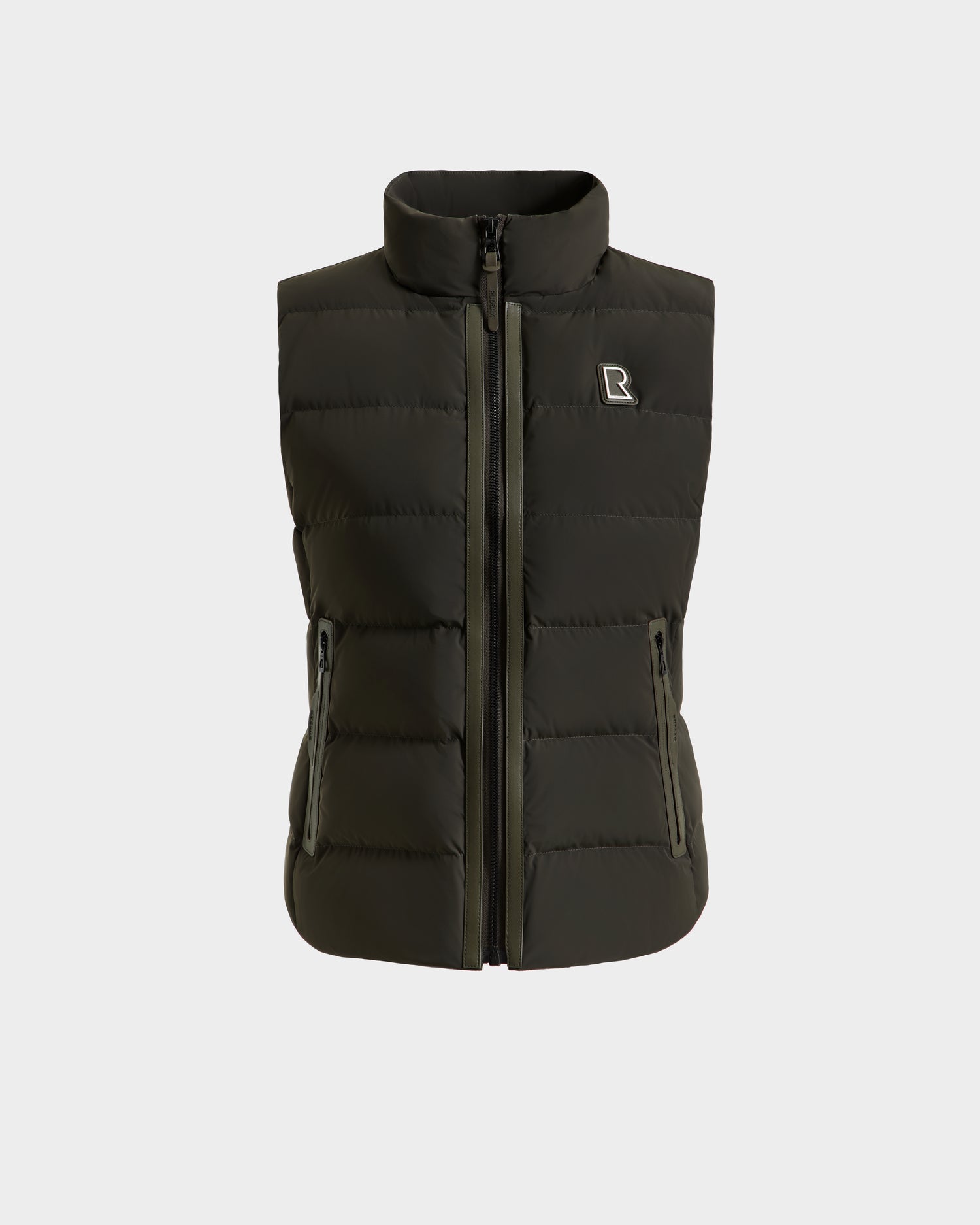 The Rudsak GABRIELA - 8125014 Dark Olive puffer vest features a front zipper, vegan leather trim, two zippered side pockets, and a small R logo on the left chest, shown against a plain white background.