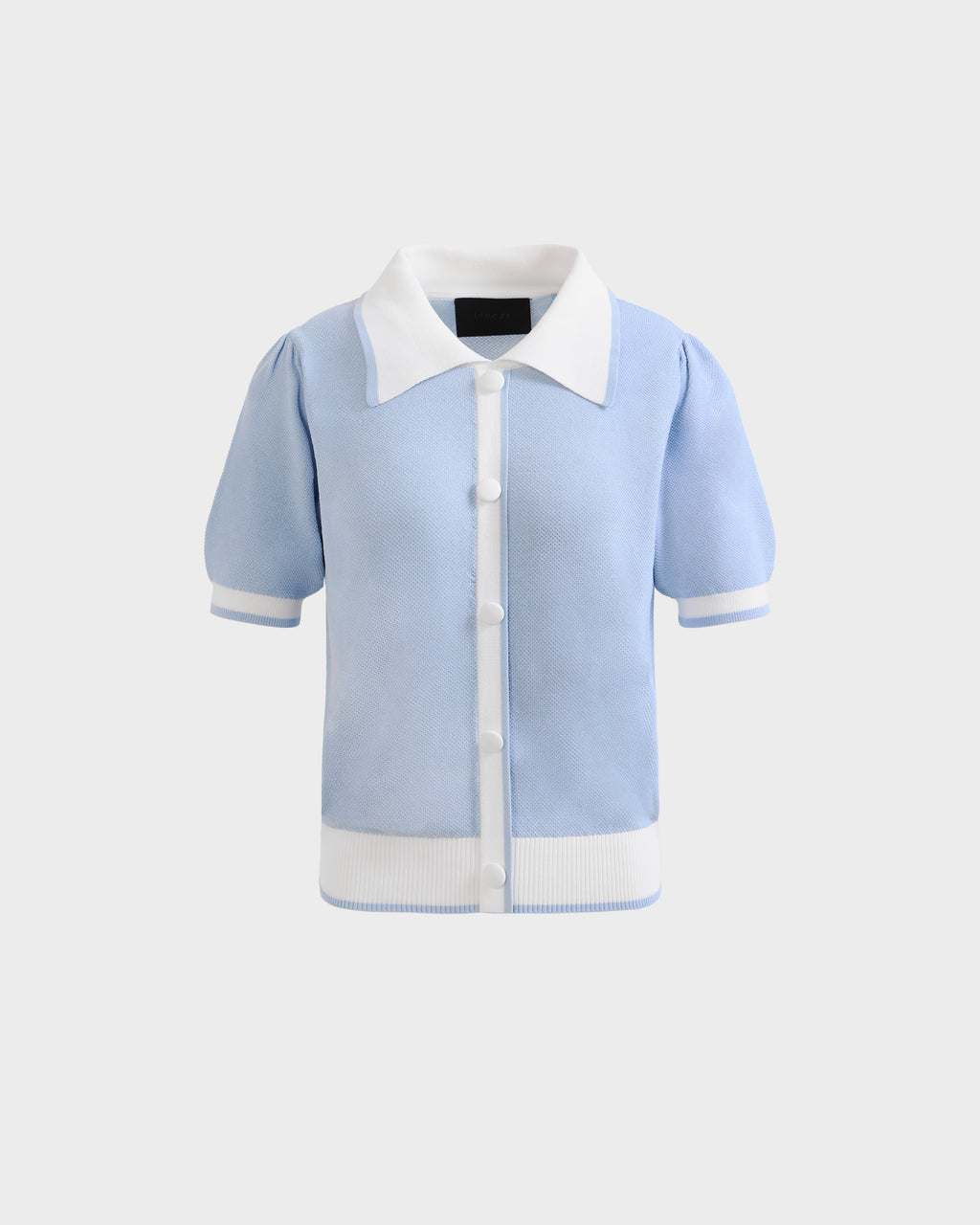 The IRIS - 8526012 Powder Blue short-sleeve sweater by Rudsak features a white contrast collar, button-down front, sleeve trim, and waistband, shown on a plain light gray background.