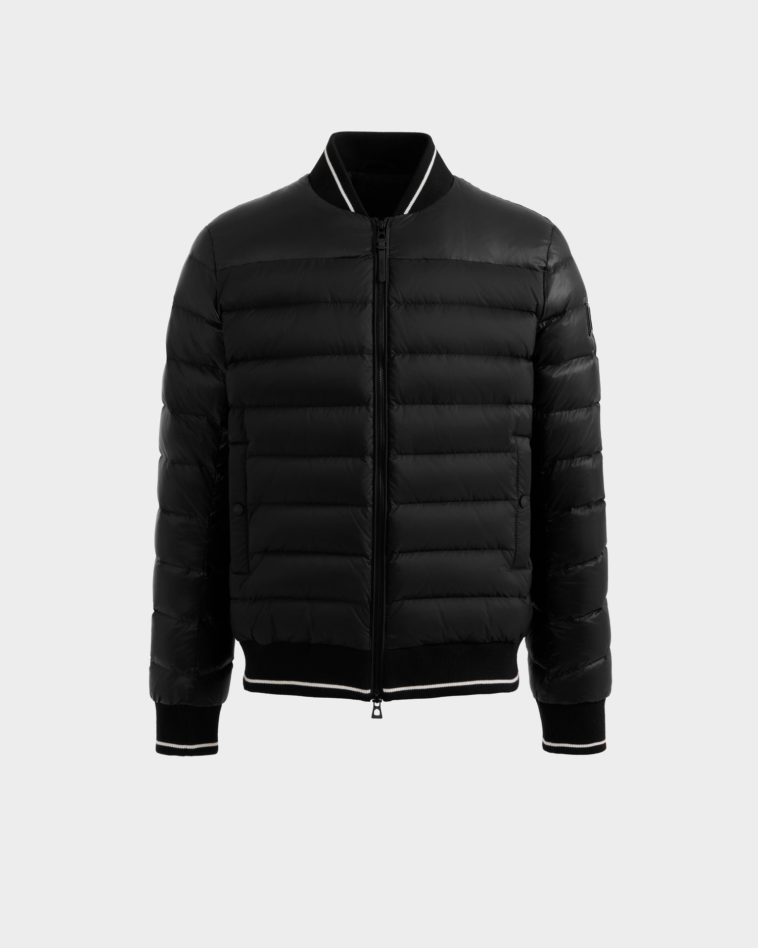 The Rudsak JEREMY - 6125025 Black men's bomber jacket features premium down insulation, a front zipper, ribbed cuffs, collar, and hem with white trim—ideal for minimalist wardrobes. Shown on a plain white background.
