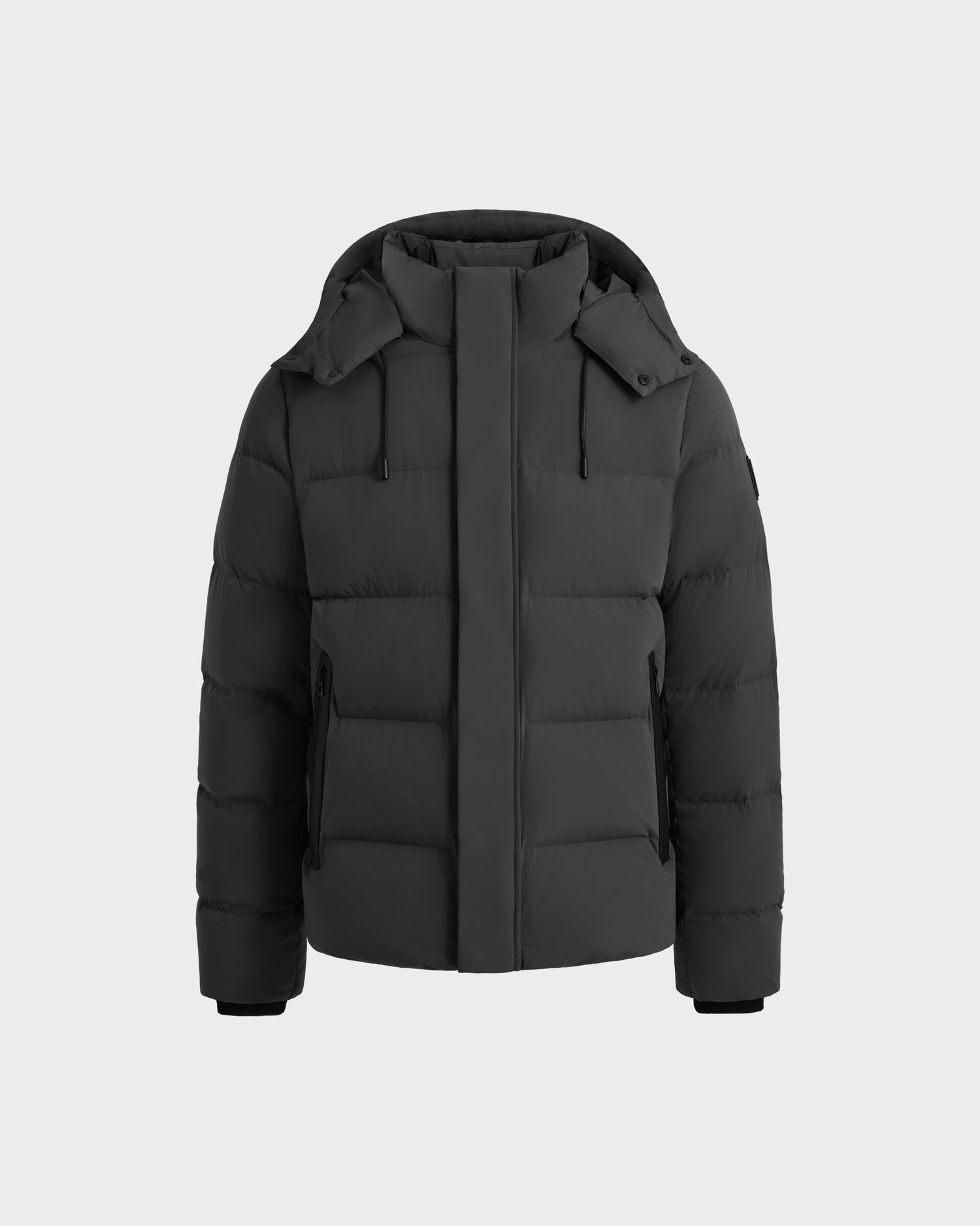 The JOEL - 6124605 Grey by Rudsak is a mens puffer jacket with a hood, zip front under a flap, side pockets, and long sleeves for cold weather, shown against a plain light gray background.