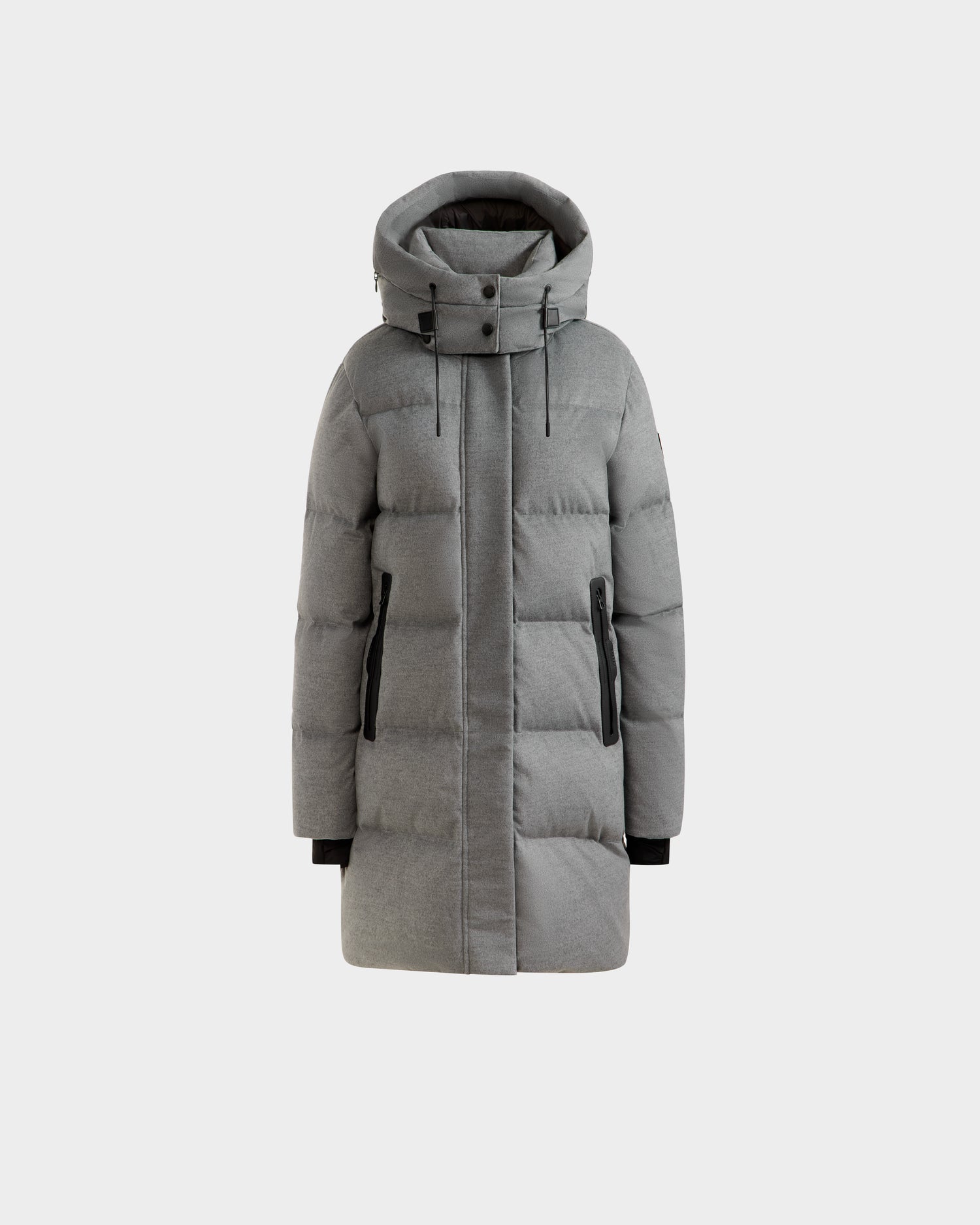 The Rudsak JOELLE W - 8125567 Heather Charcoal is a gray, knee-length women’s down puffer jacket with a hood, black zipper pockets, and black cuffs—an essential for stylish warmth.