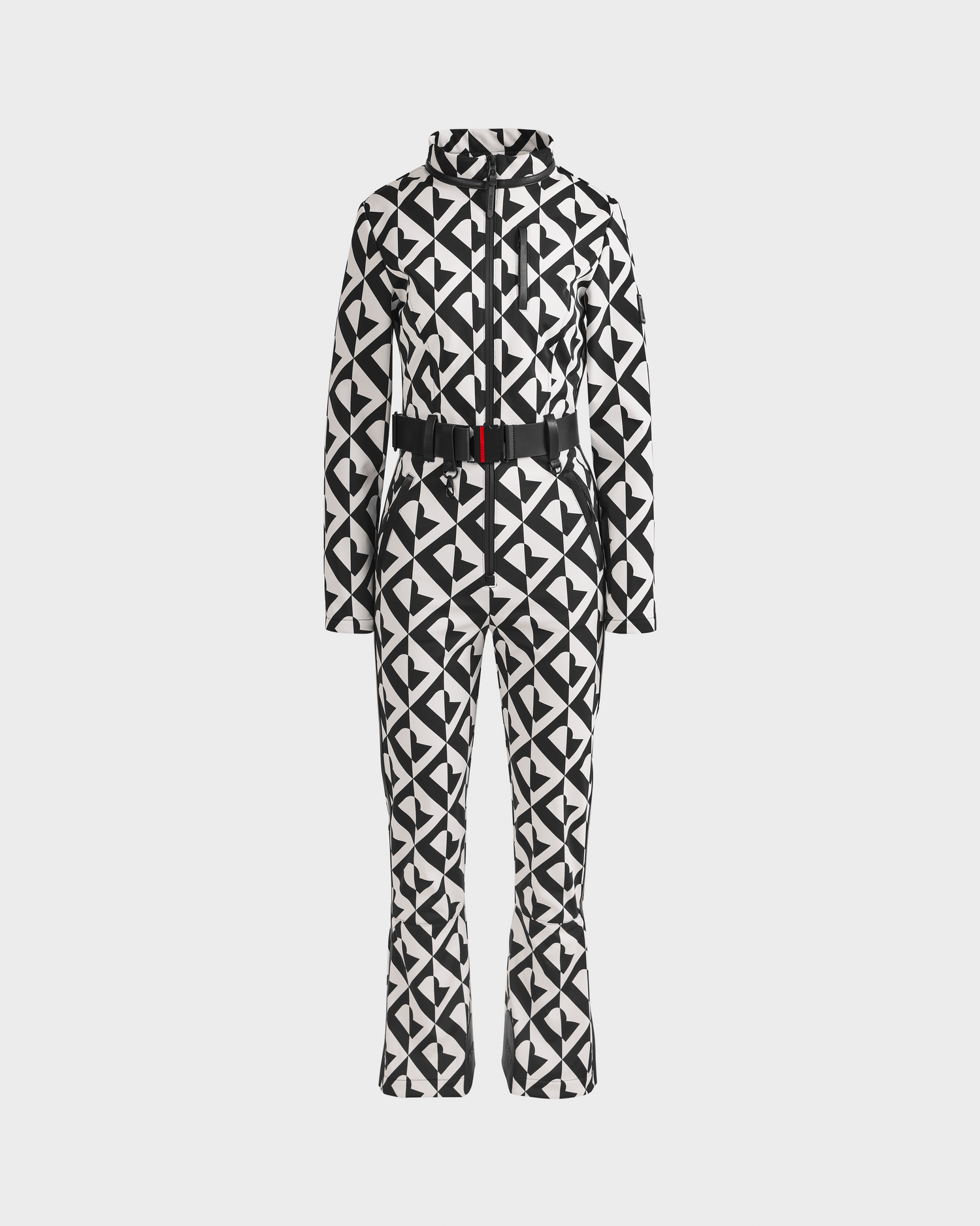 The Rudsak JOSIE - 8124817 Vanilla Monogram women’s ski suit features a black and white geometric print, fitted waist, front zipper, high collar, flared legs, and RECCO rescue technology, shown on a plain white background.