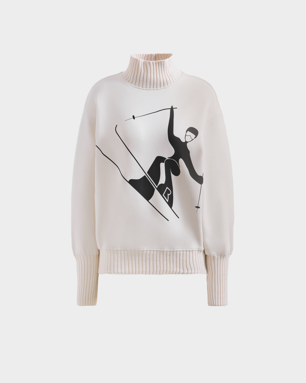 The Rudsak JOYCE - 8525647 Vanilla is a cream women's cotton-blend ski sweater with ribbed cuffs and hem and a black skier graphic, ideal for après-ski style.