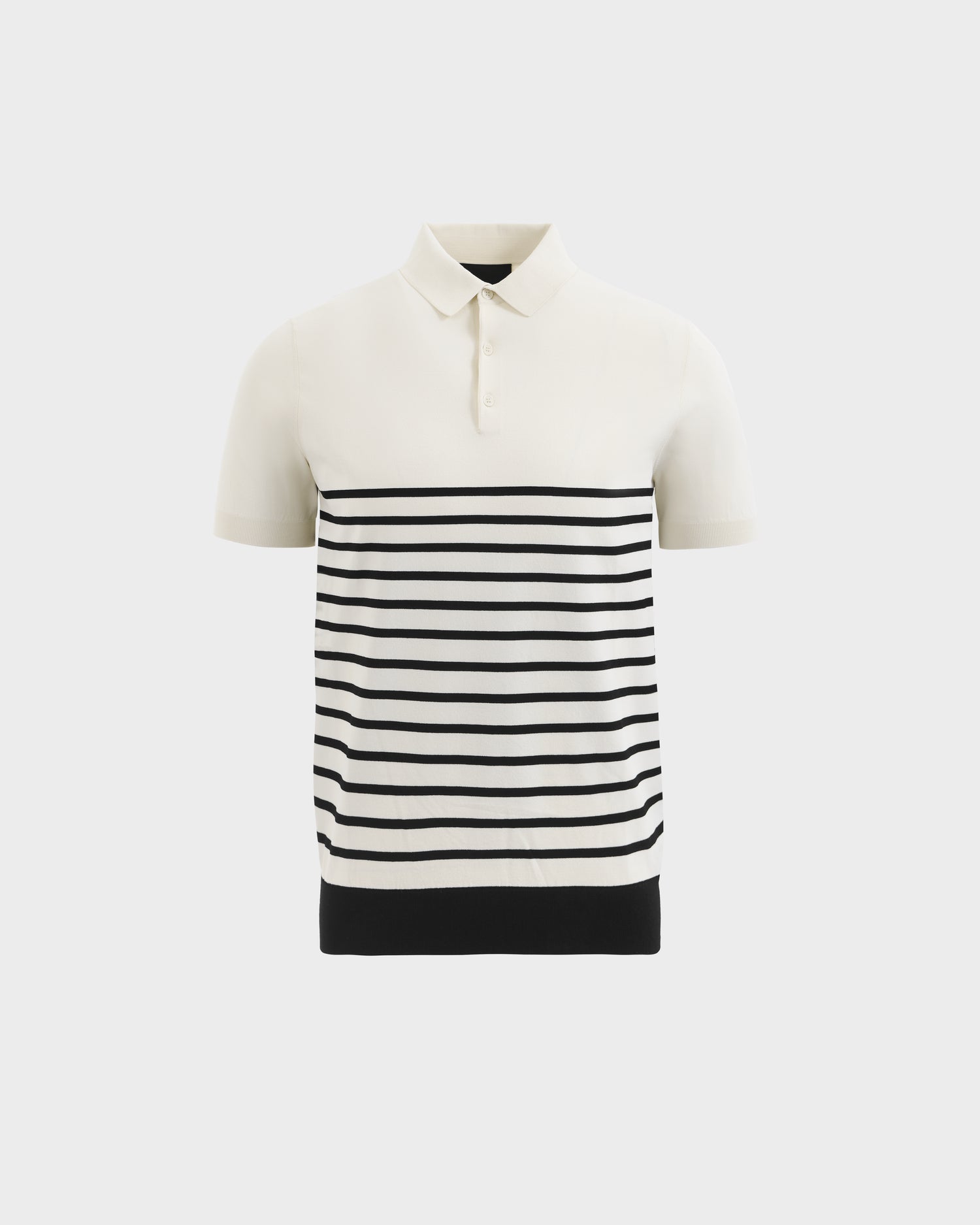 The KRIS - 6526005 Iceland by Rudsak is a short-sleeve polo with a white collar and top, horizontal black stripes on the lower half, and a solid black hem.