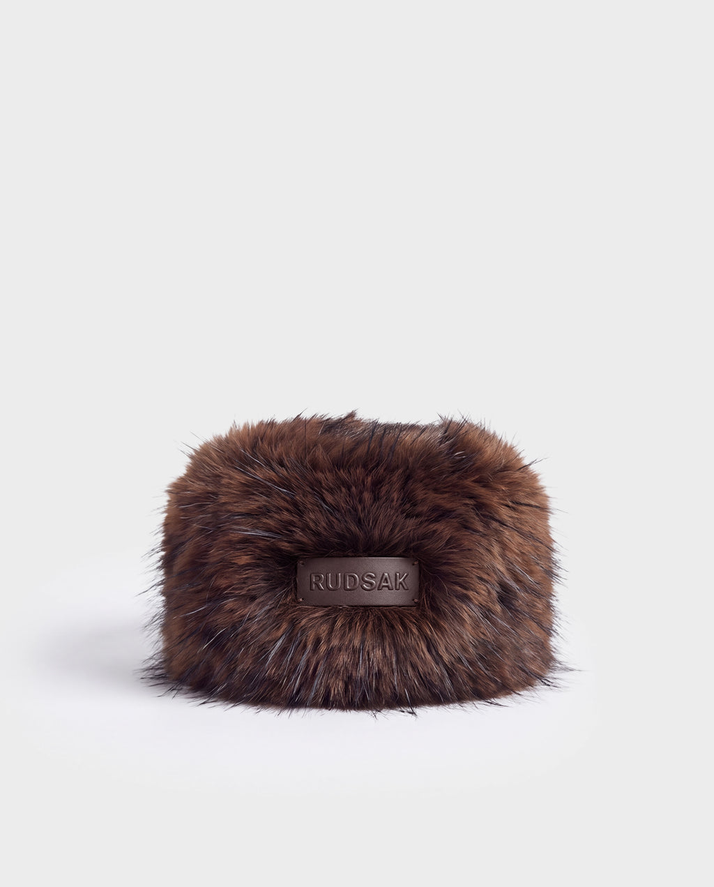Brown faux fur LORETTA - 8426503 Mix Espresso hat with a rectangular logo patch on the front.