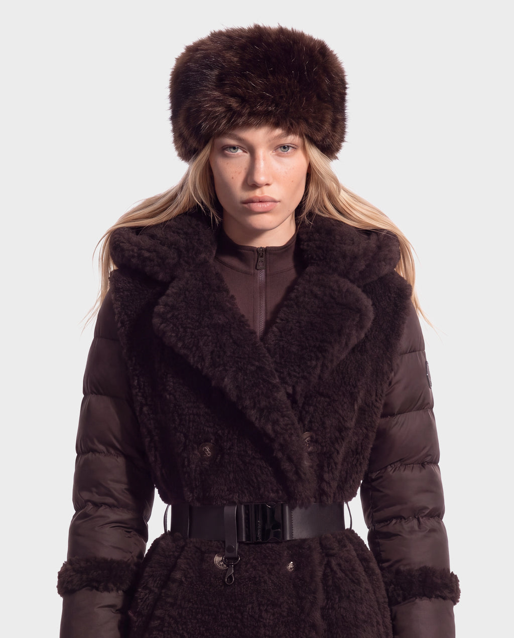 Model wearing a LORETTA - 8426503 Mix Espresso dark brown down coat with a faux fur collar and matching faux fur hat.