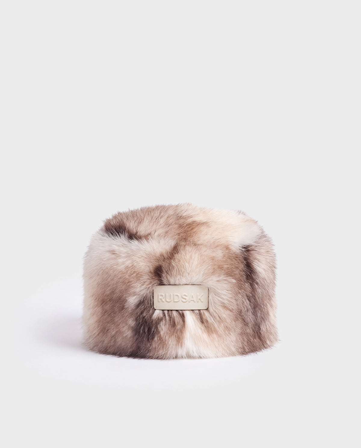 LORETTA - 8426503 Mix Vanilla cylindrical faux fur hat in a cream and brown blend with a central rectangular logo patch.