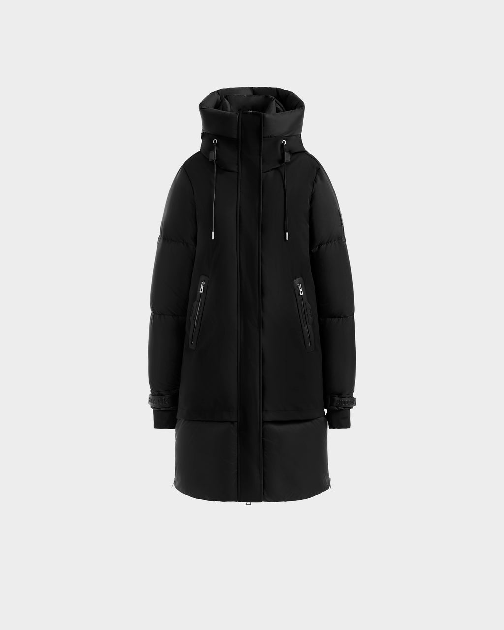 The Rudsak LAYAN - 8124576 Black/Vanilla is a black premium down puffer jacket with a hood, long sleeves, front zip, and two diagonal zippered pockets, shown on a plain light gray background.