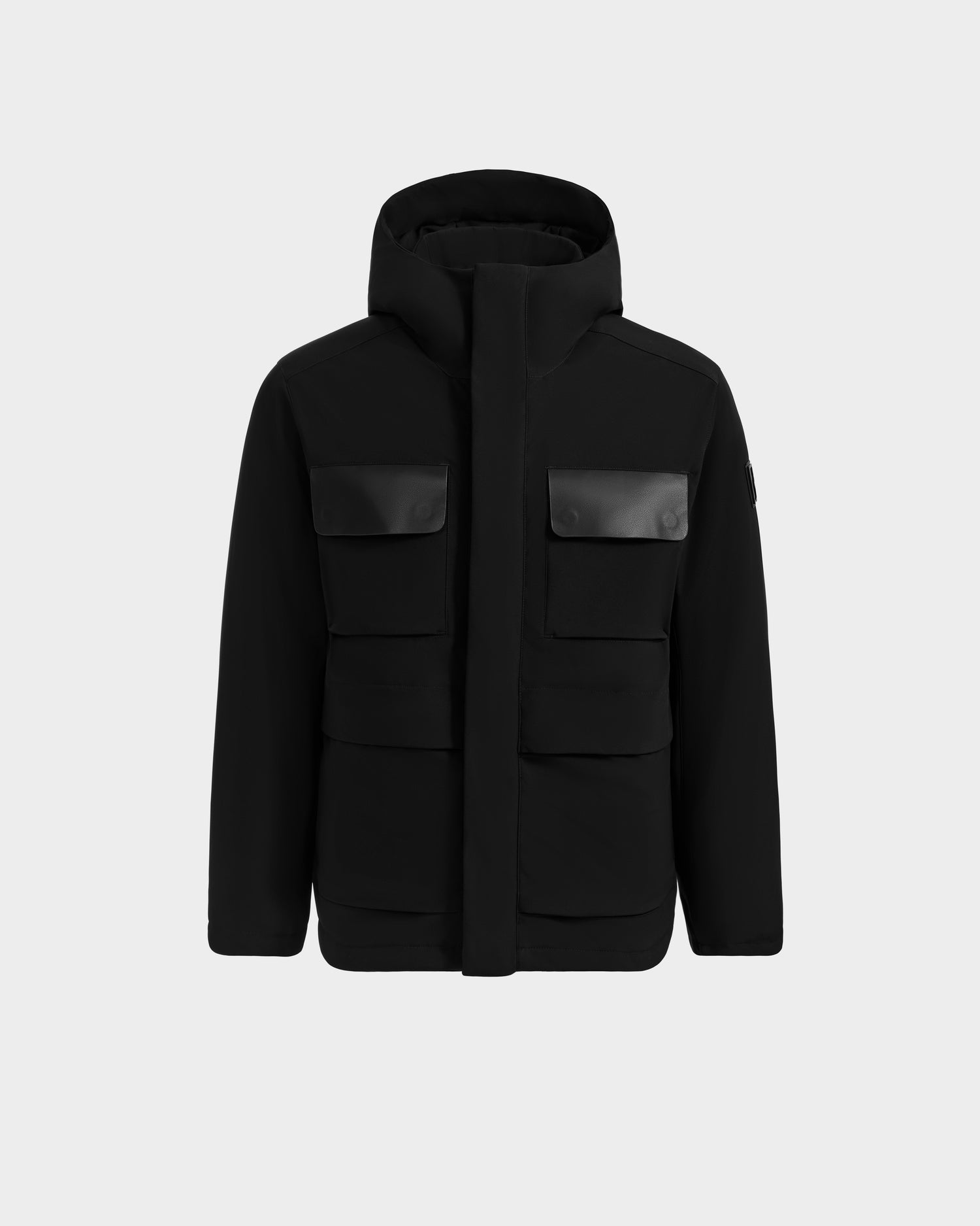 The Rudsak LAZIO - 6125527 Black men’s hooded parka features four front flap pockets and is displayed on a plain light gray background, showcasing it as a true winter essential.