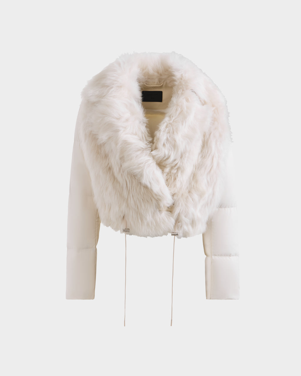 The Rudsak LILAH - 8125509 Vanilla is a stylish women's cropped jacket in off-white, featuring quilted puffer sleeves, a plush oversized faux fur collar, and adjustable waist drawstrings for added flair.