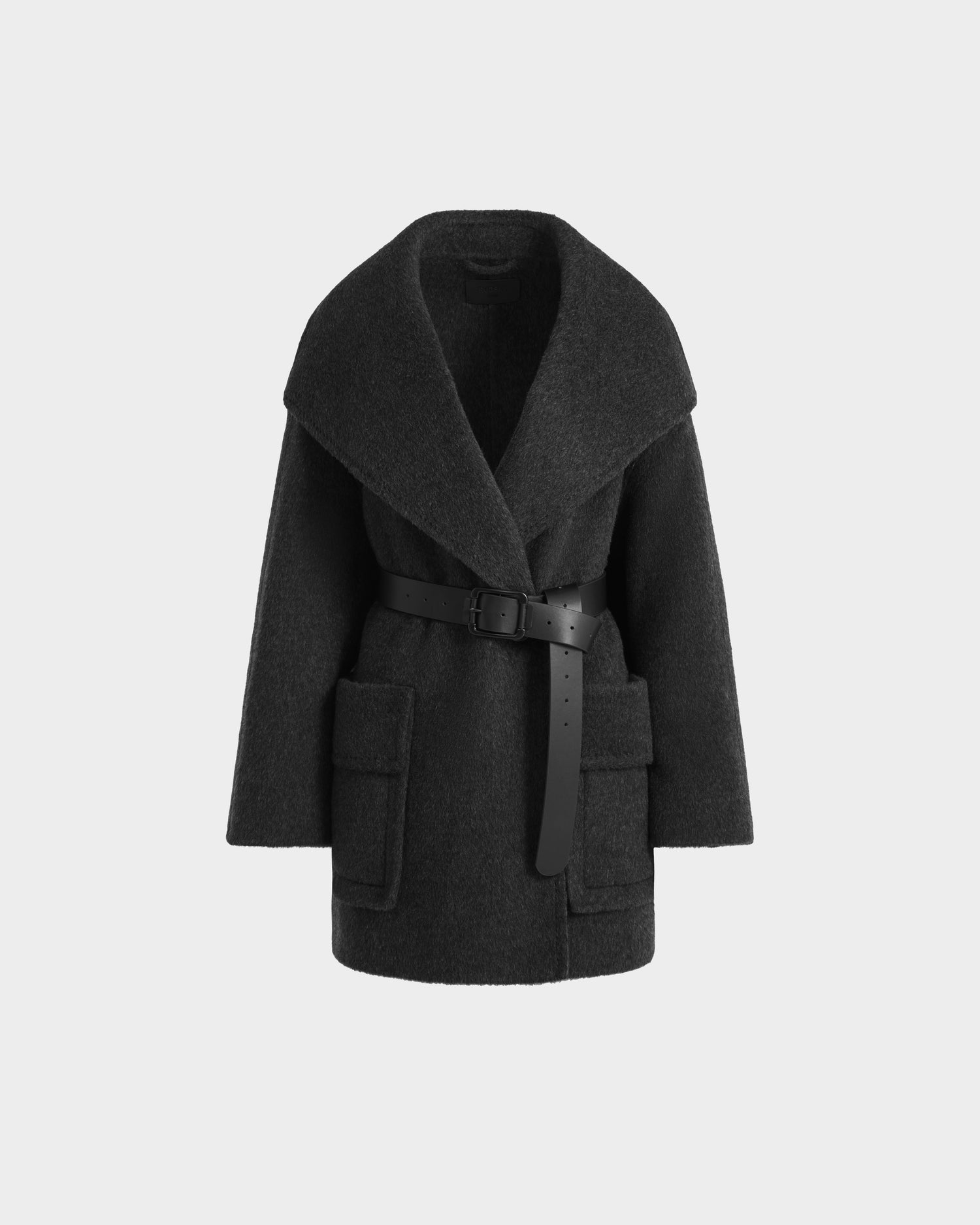 The Rudsak LUCIA - 8125633 Heather Black women’s transitional wool jacket features wide lapels, large front pockets, and a removable vegan leather belt at the waist, shown against a plain light background.