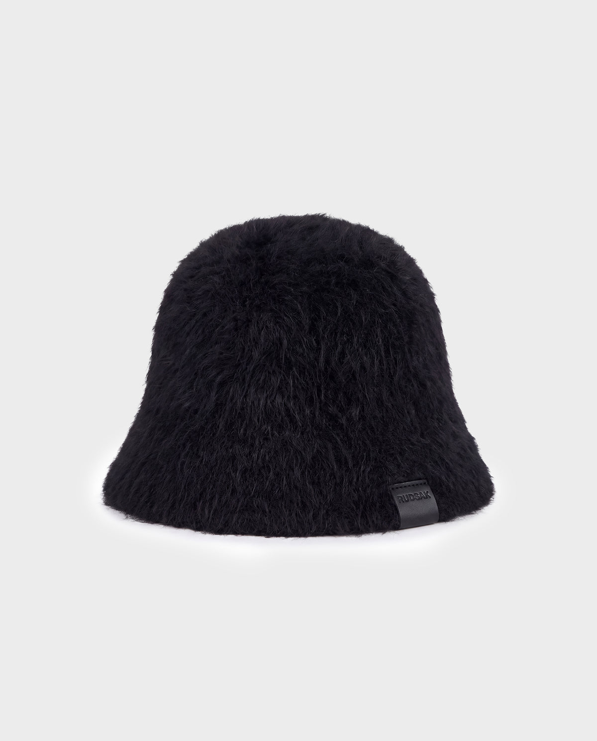 Black Rudsak MAIE - 8426517 fuzzy bucket hat with a small branded leather tab on the brim.