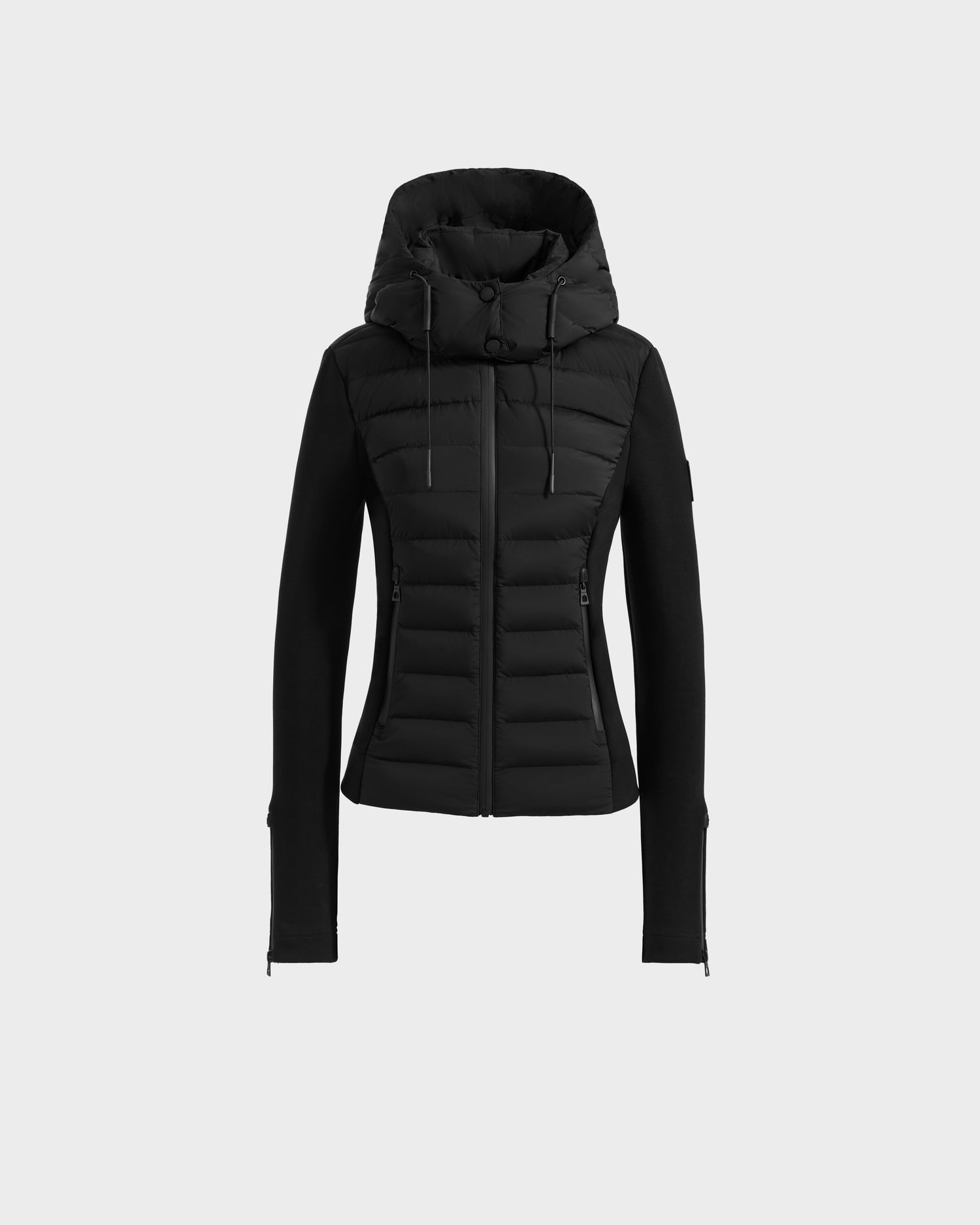 The Rudsak MABS - 8125055 Black is a fitted women’s puffer jacket with RDS-certified down fill, quilted design, hood, front zipper, side pockets, and long sleeves, shown on a plain light gray background.