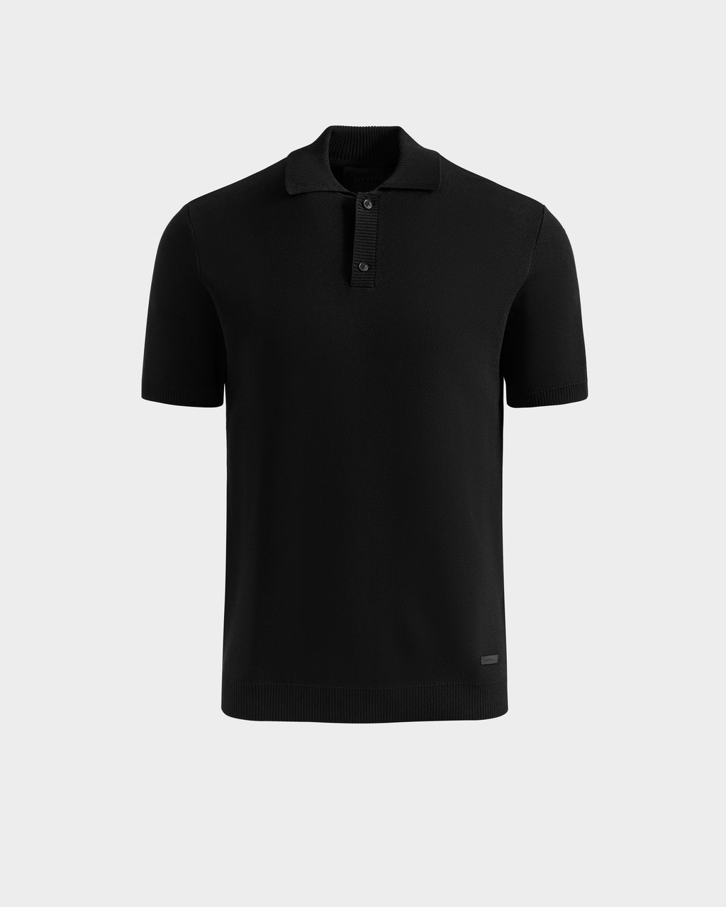 The Rudsak MAISEN - 6524518 Black polo features short sleeves, a collar, and three buttons—an ideal modern men's addition—shown on a light gray background.