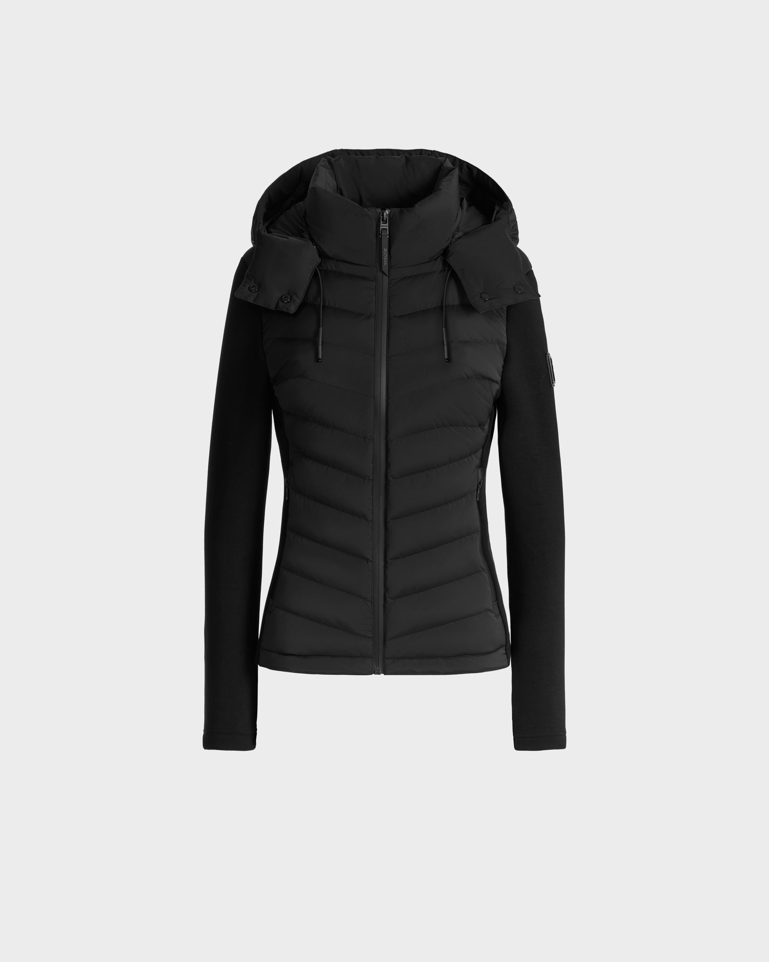 The Rudsak MALYA M - L125036 Black is an activewear-inspired fitted down quilted jacket with a hood, long sleeves, and a front zipper, shown on a plain light gray background.