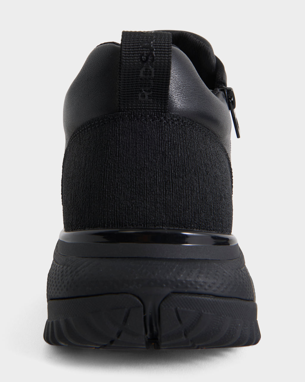 Rear view of the Rudsak MAX - 6226502 Black men’s sneaker featuring utility-inspired design, textured knit fabric, a rubber sole, pull tab on the heel, and subtle stitching details, shown against a plain white background.
