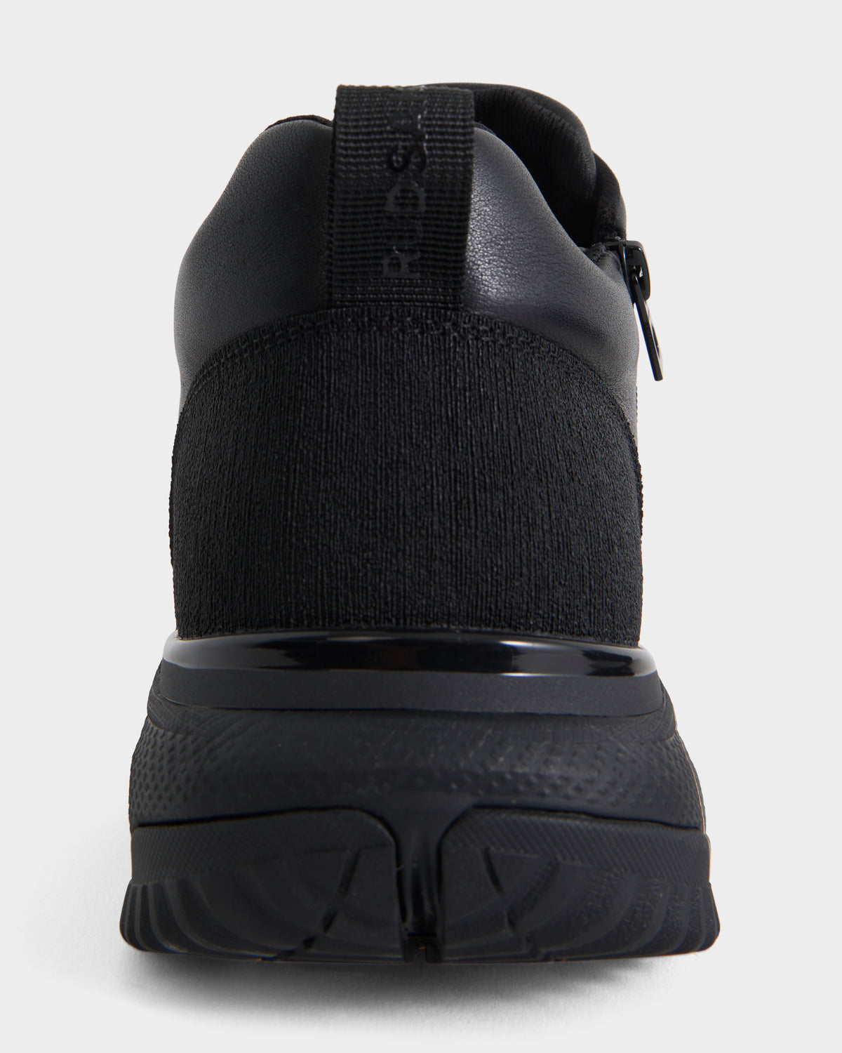 Rear view of the Rudsak MAX - 6226502 Black men’s sneaker featuring utility-inspired design, textured knit fabric, a rubber sole, pull tab on the heel, and subtle stitching details, shown against a plain white background.
