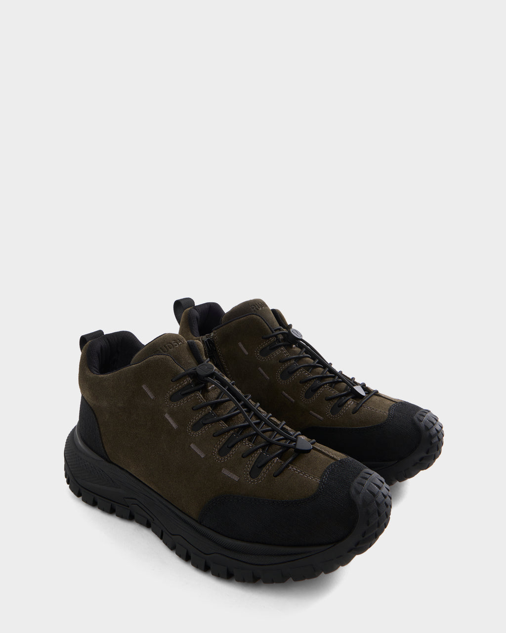 A pair of Rudsak MAX S - 6226505 Olive hiking shoes, featuring a dark green and black color scheme with thick, rugged soles, front laces, reinforced toe caps, trail-inspired details, and subtle suede accents, displayed on a plain white background.