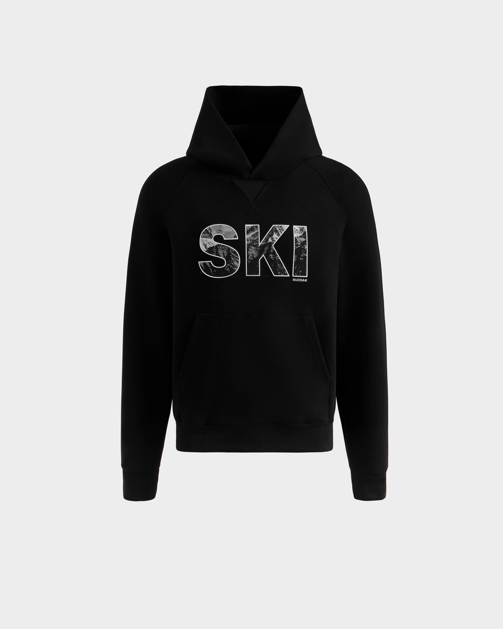 The Rudsak MIKAEL - 6525647 Black men’s ski hoodie features bold, distressed white "SKI" lettering across the chest, a front pocket, and comes in classic black—perfect for upgrading your winter style. Shown on a plain light gray background.