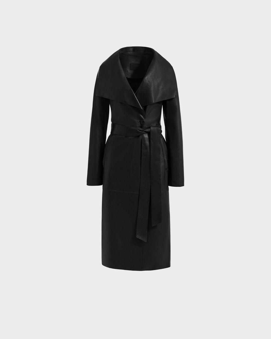 The Rudsak MURMU X - 8125670 Black is a long black leather trench coat with a wide collar and matching belt, displayed on a plain light gray background.